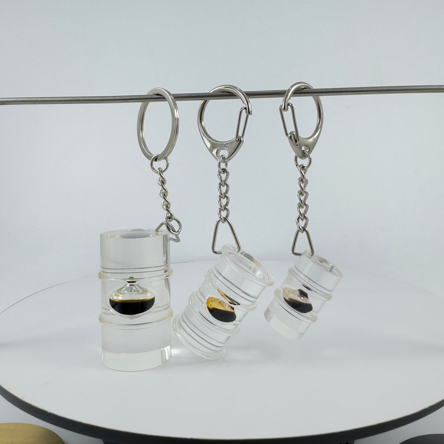 TRANSPARENT KEY CHAIN ENCAPSULATED WITH TEAR DROP OIL BOTTLE