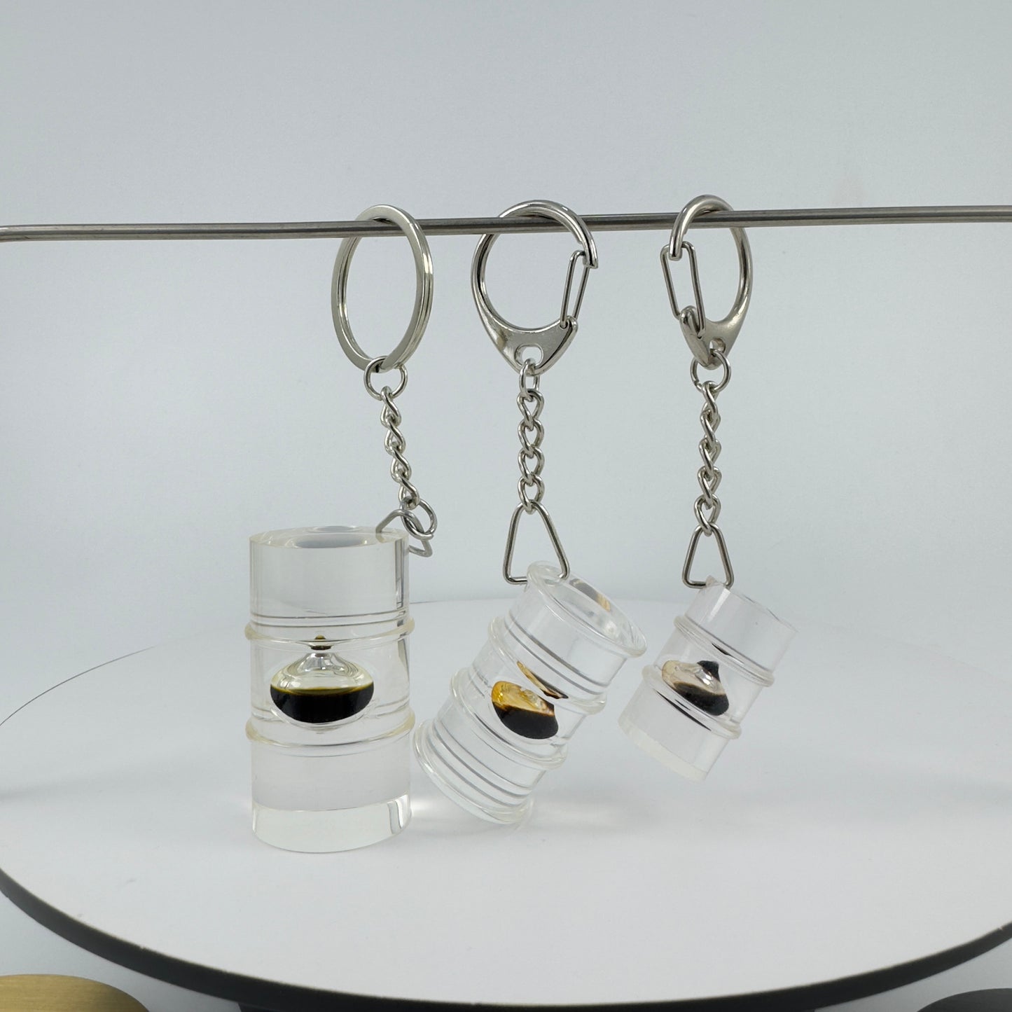 TRANSPARENT KEY CHAIN ENCAPSULATED WITH TEAR DROP OIL BOTTLE