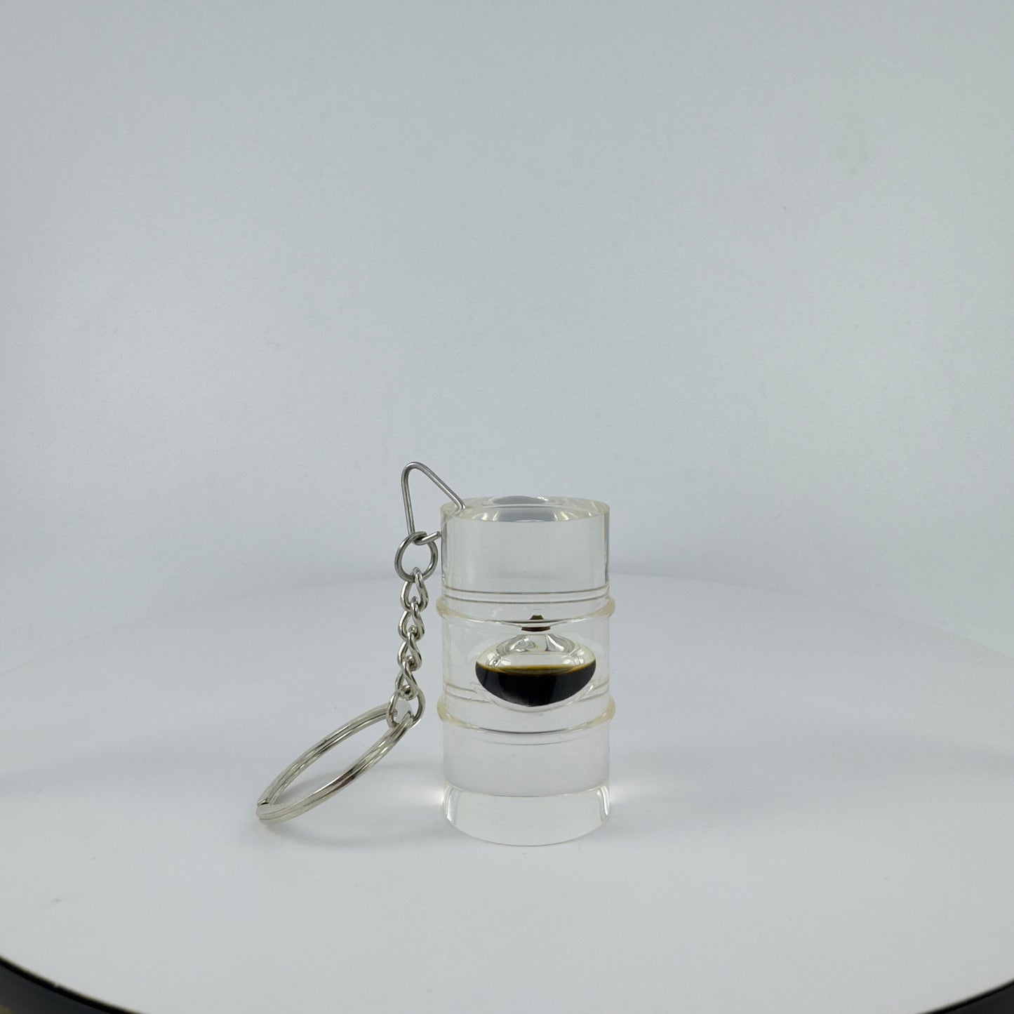 TRANSPARENT KEY CHAIN ENCAPSULATED WITH TEAR DROP OIL BOTTLE