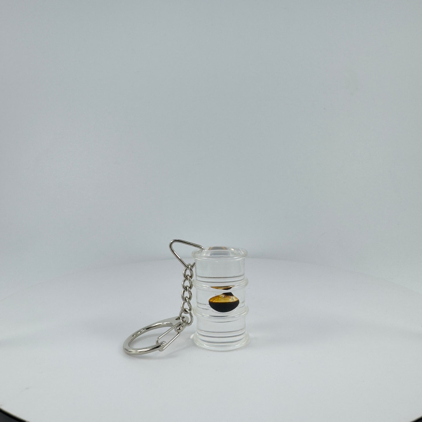 TRANSPARENT KEY CHAIN ENCAPSULATED WITH TEAR DROP OIL BOTTLE
