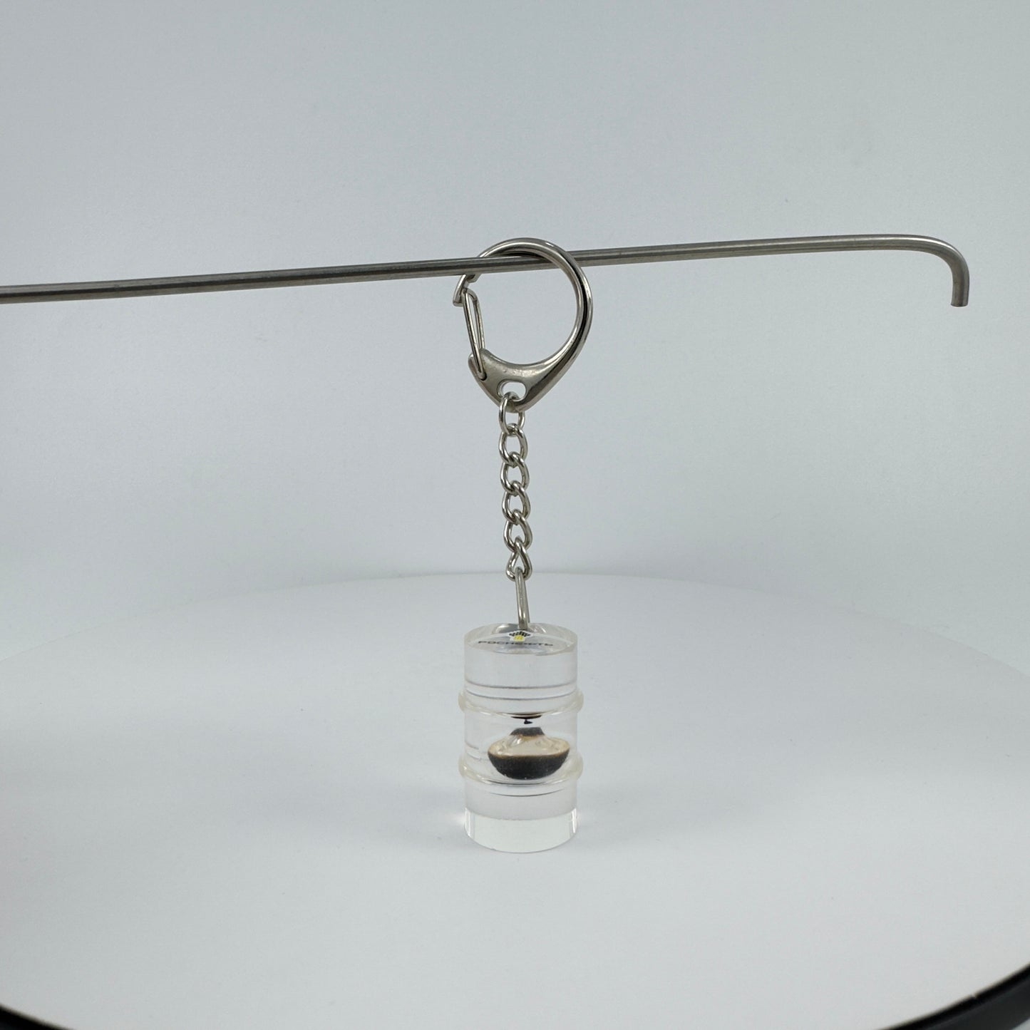 TRANSPARENT KEY CHAIN ENCAPSULATED WITH TEAR DROP OIL BOTTLE