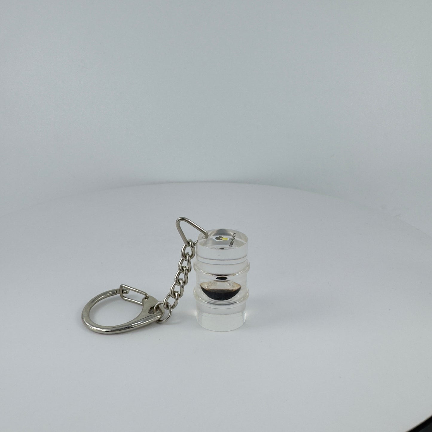 TRANSPARENT KEY CHAIN ENCAPSULATED WITH TEAR DROP OIL BOTTLE