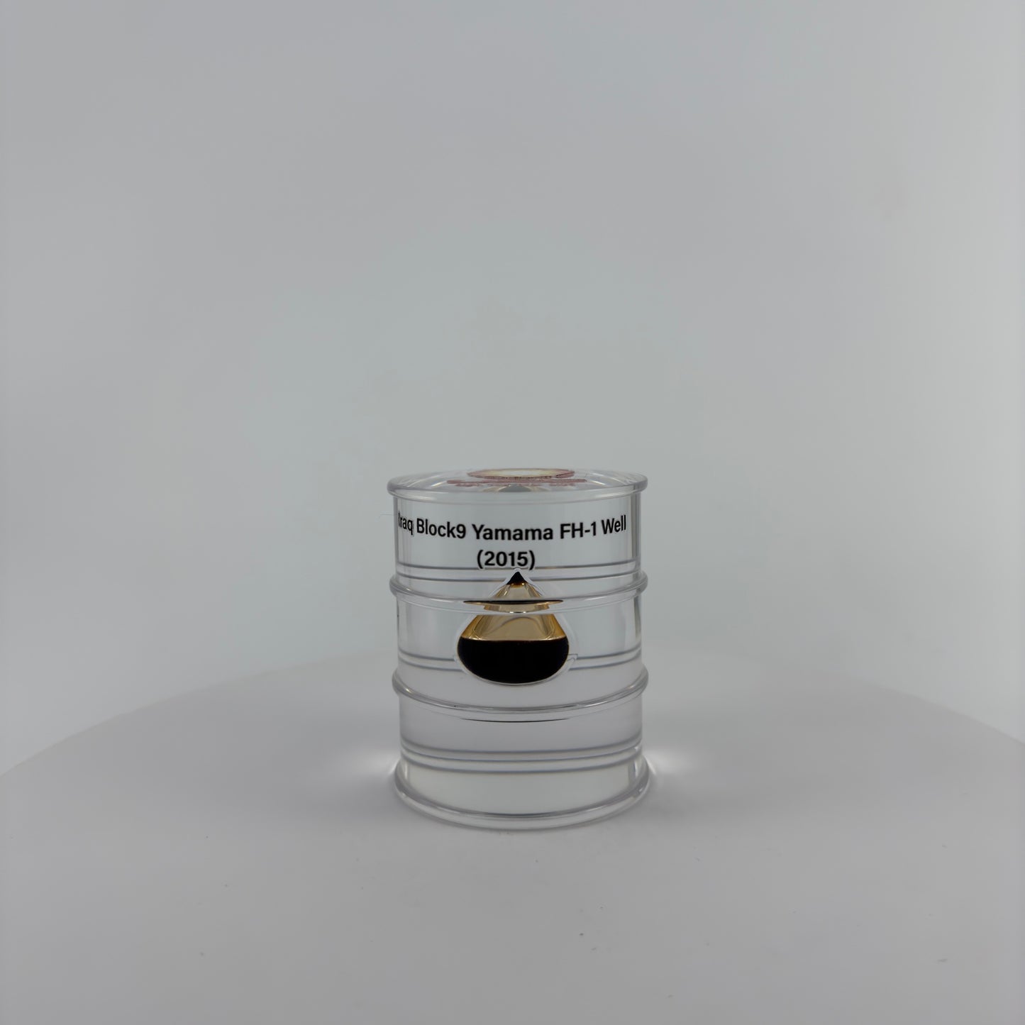 TRANSPARENT PAPER WEIGHT ENCAPSULATED WITH TEAR DROP OIL BOTTLE
