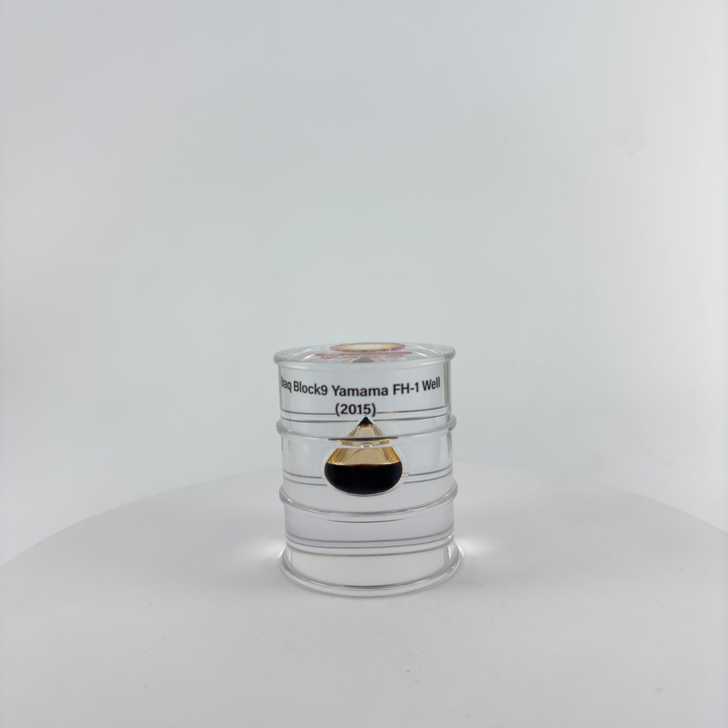 TRANSPARENT PAPER WEIGHT ENCAPSULATED WITH TEAR DROP OIL BOTTLE