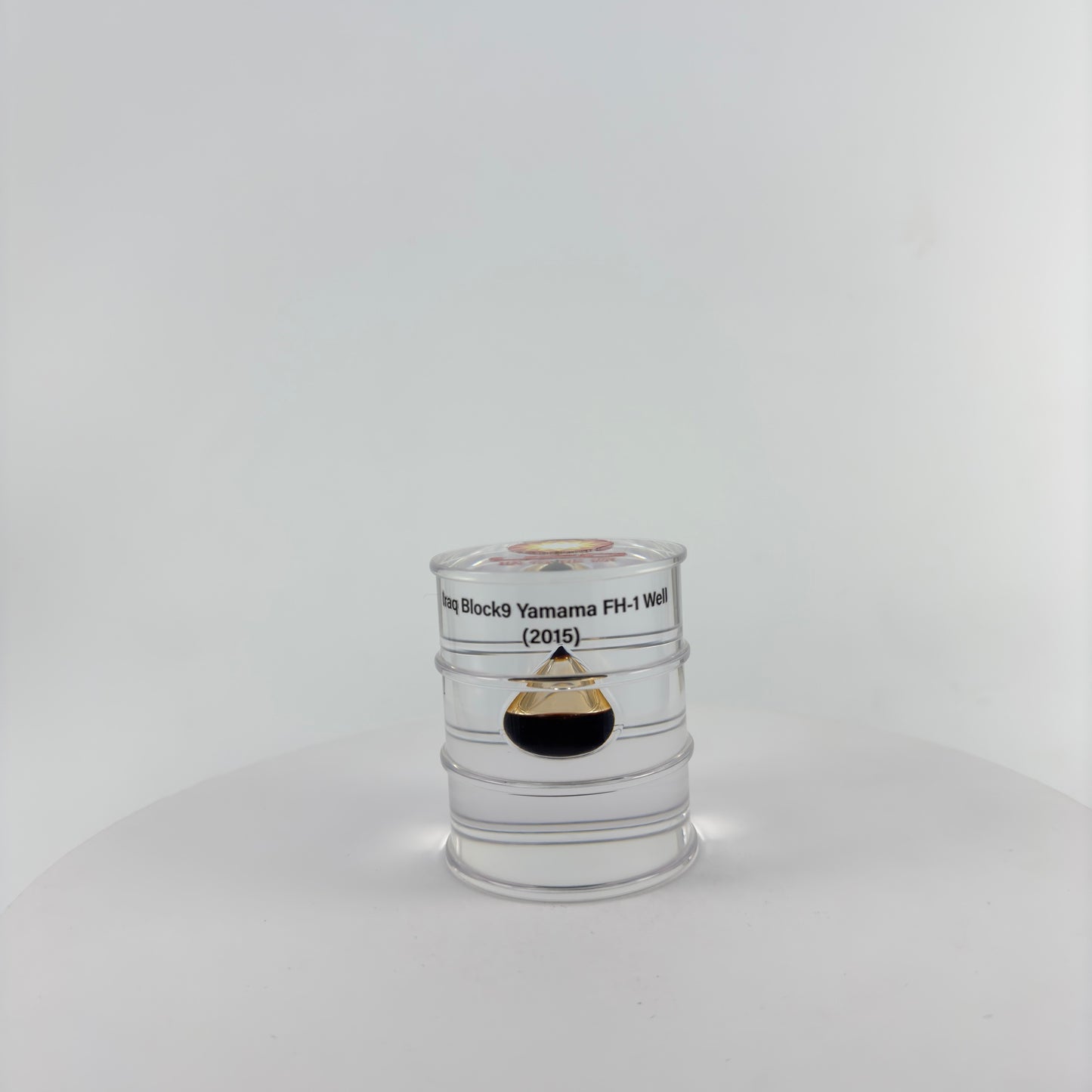 TRANSPARENT PAPER WEIGHT ENCAPSULATED WITH TEAR DROP OIL BOTTLE