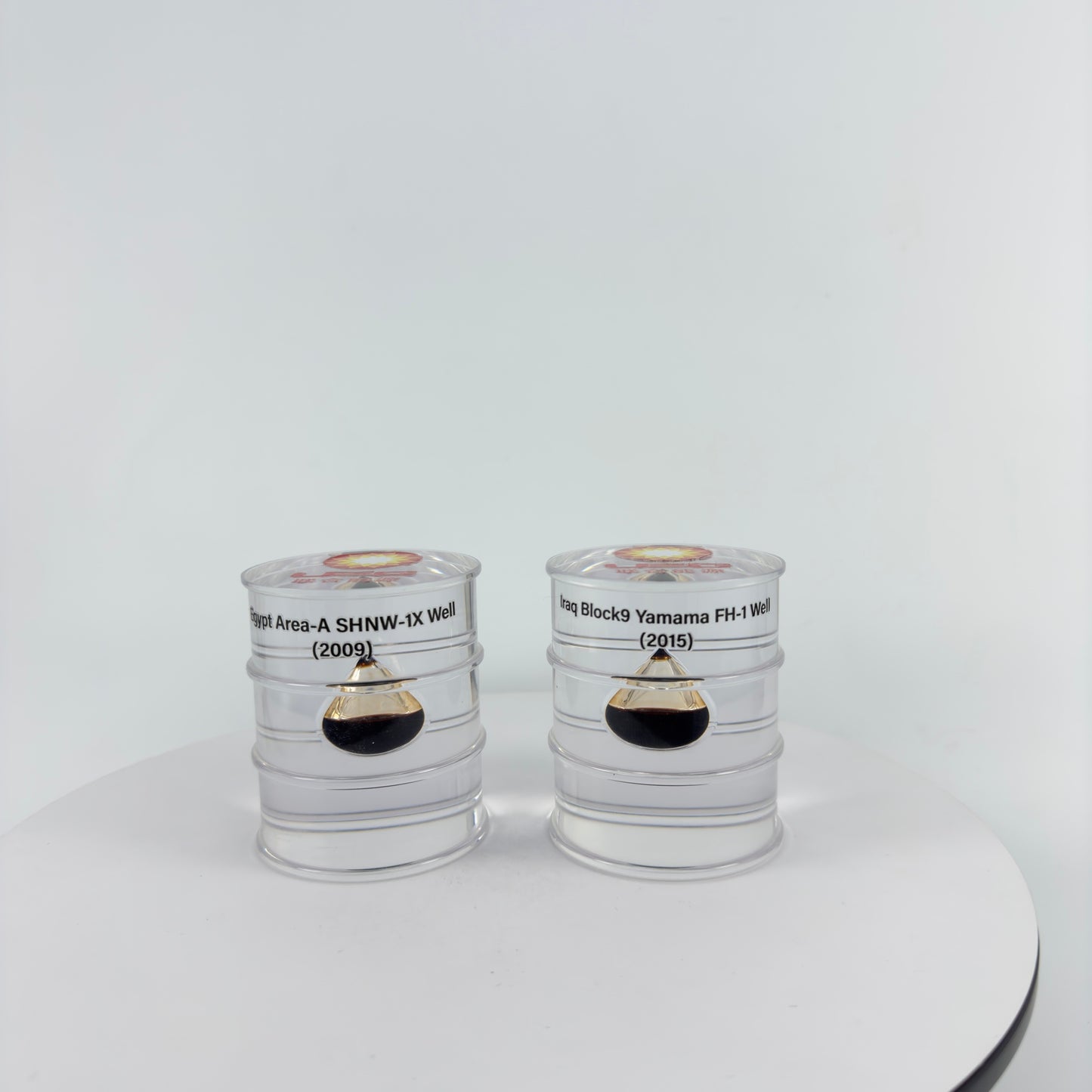 TRANSPARENT PAPER WEIGHT ENCAPSULATED WITH TEAR DROP OIL BOTTLE