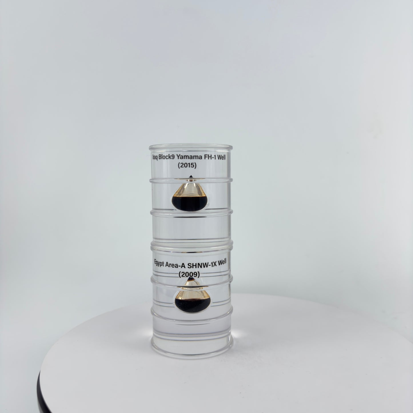 TRANSPARENT PAPER WEIGHT ENCAPSULATED WITH TEAR DROP OIL BOTTLE
