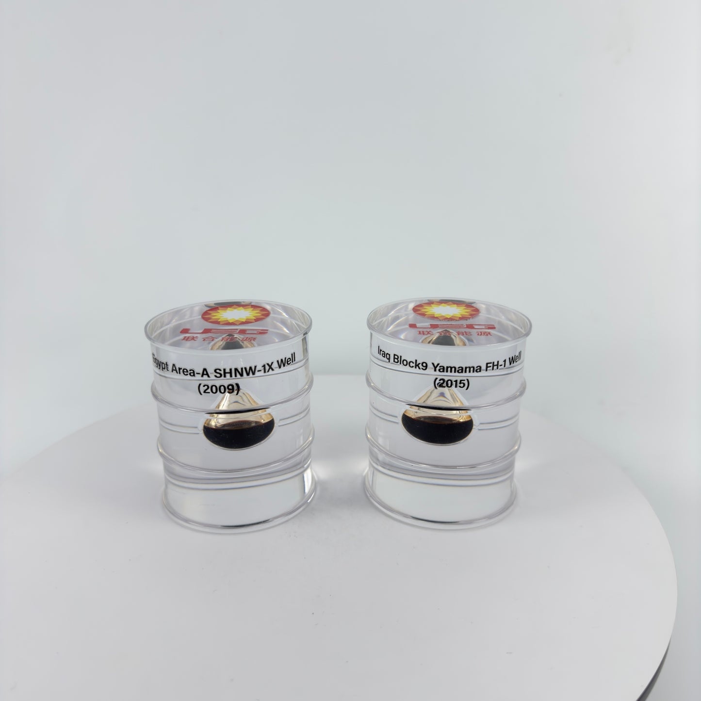 TRANSPARENT PAPER WEIGHT ENCAPSULATED WITH TEAR DROP OIL BOTTLE