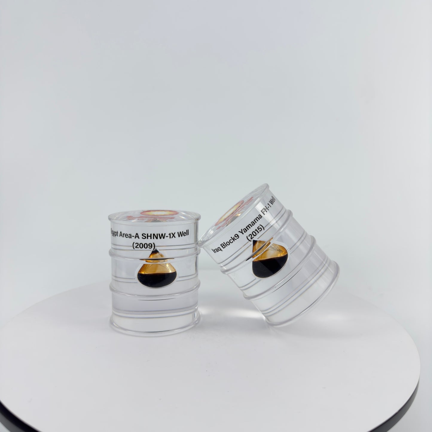 TRANSPARENT PAPER WEIGHT ENCAPSULATED WITH TEAR DROP OIL BOTTLE