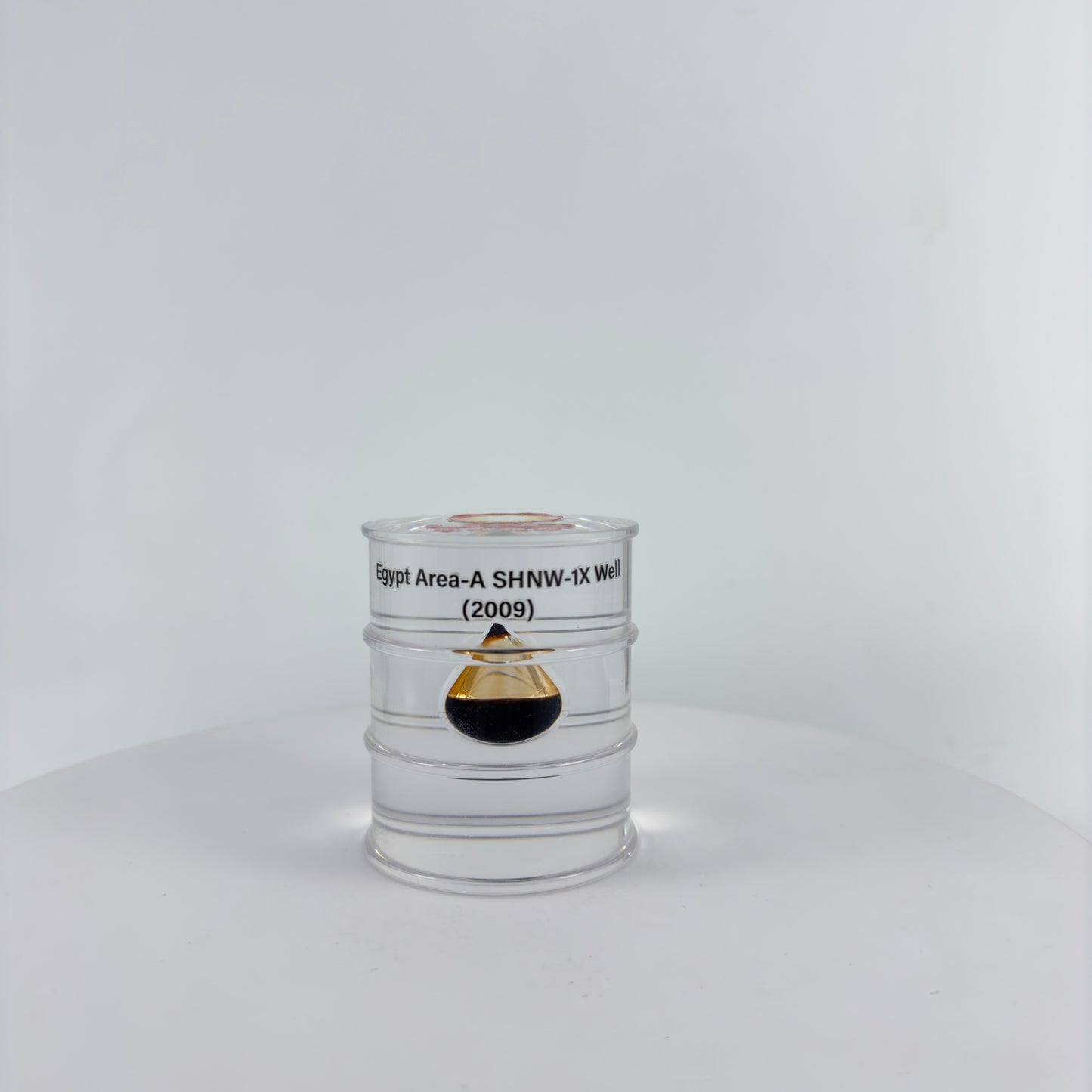 TRANSPARENT PAPER WEIGHT ENCAPSULATED WITH TEAR DROP OIL BOTTLE
