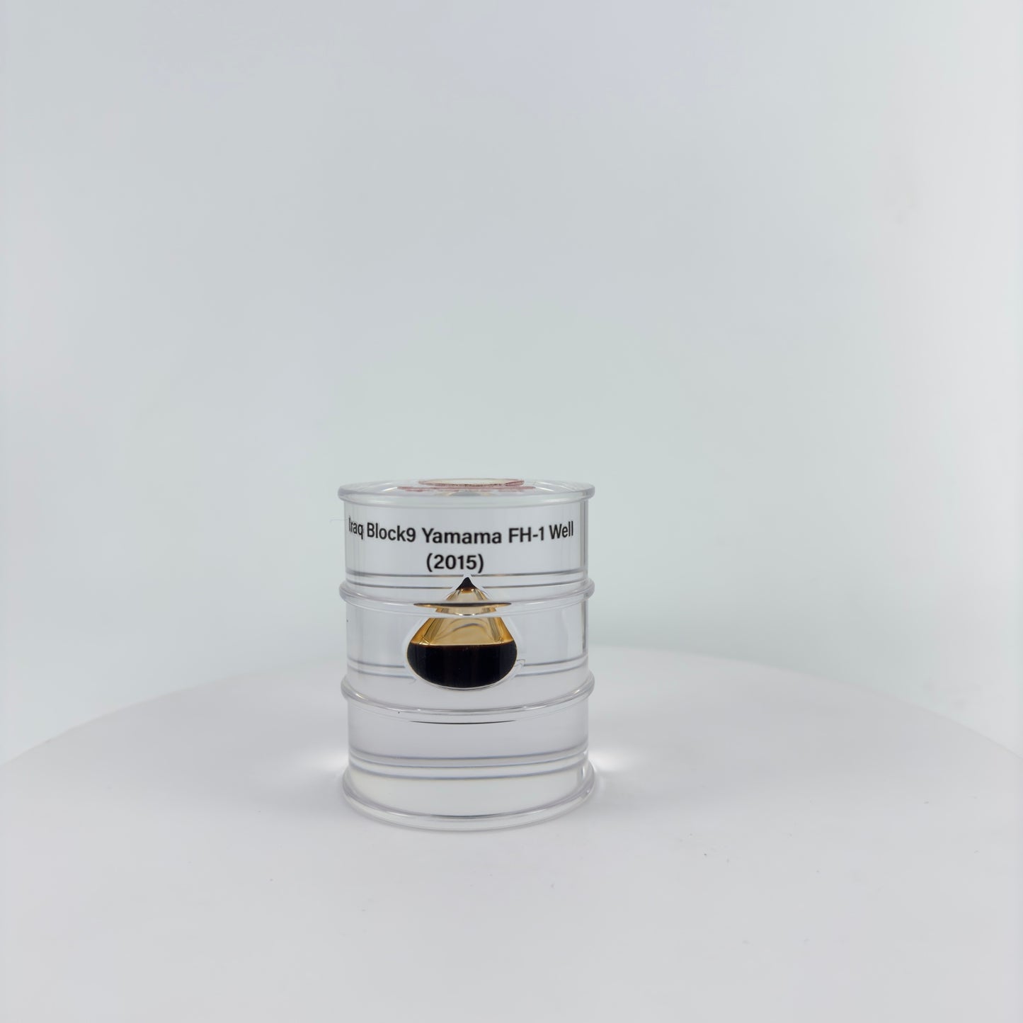 TRANSPARENT PAPER WEIGHT ENCAPSULATED WITH TEAR DROP OIL BOTTLE