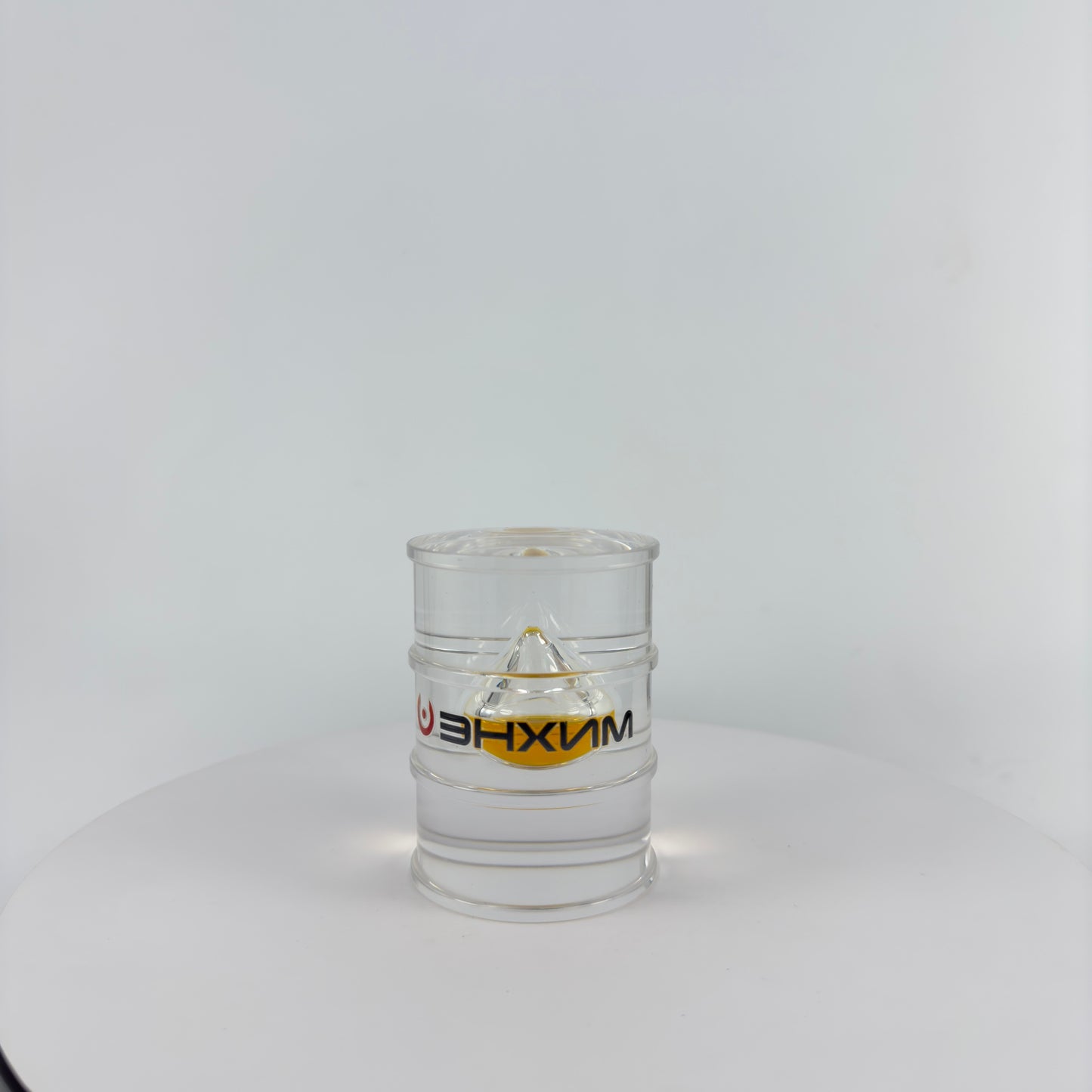 TRANSPARENT PAPER WEIGHT ENCAPSULATED WITH TEAR DROP OIL BOTTLE