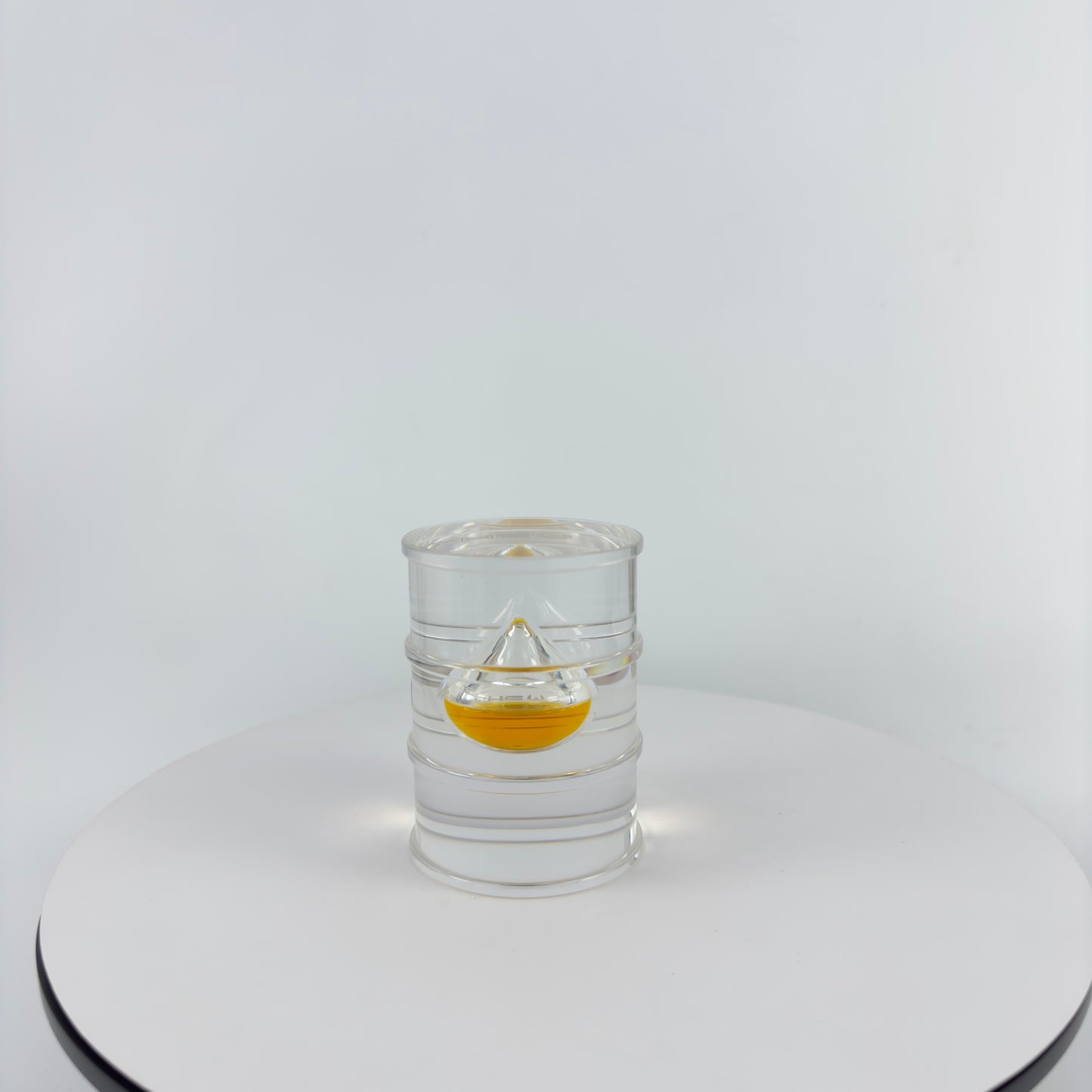TRANSPARENT PAPER WEIGHT ENCAPSULATED WITH TEAR DROP OIL BOTTLE
