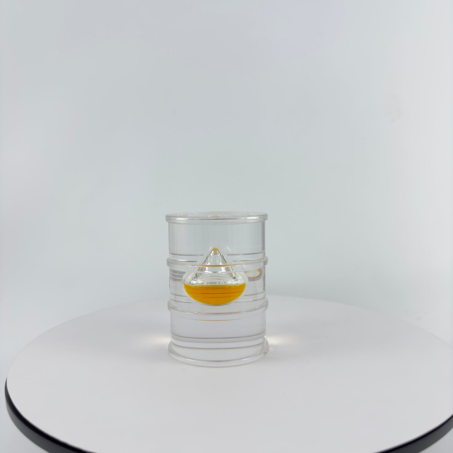 TRANSPARENT PAPER WEIGHT ENCAPSULATED WITH TEAR DROP OIL BOTTLE
