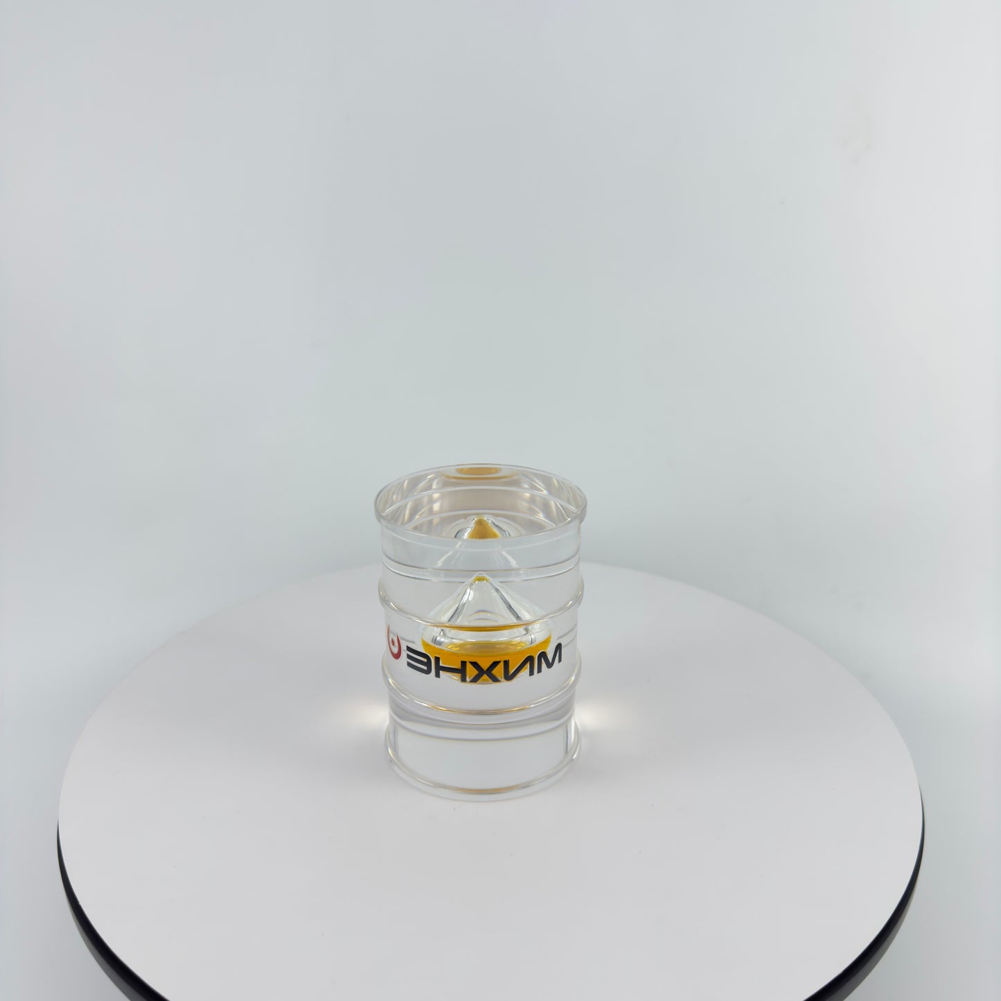 TRANSPARENT PAPER WEIGHT ENCAPSULATED WITH TEAR DROP OIL BOTTLE