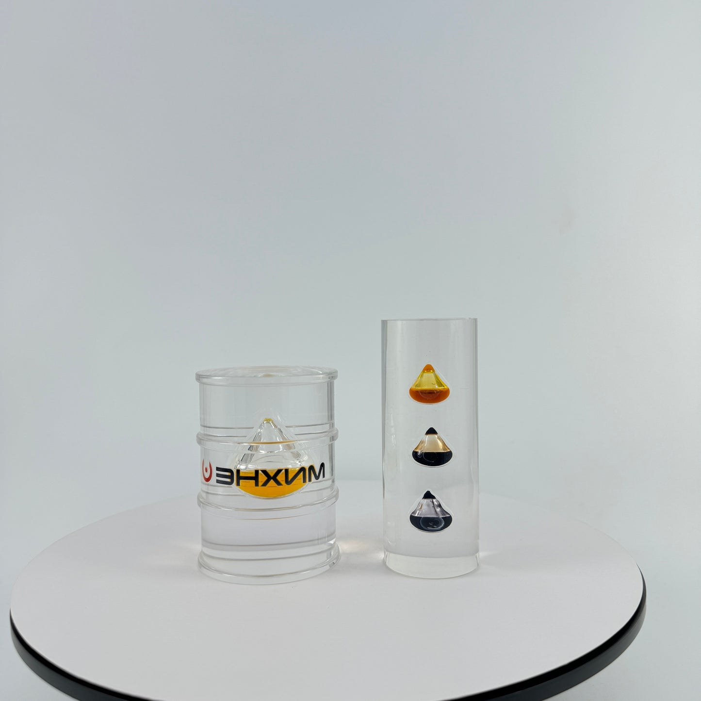 TRANSPARENT PAPER WEIGHT ENCAPSULATED WITH TEAR DROP OIL BOTTLE