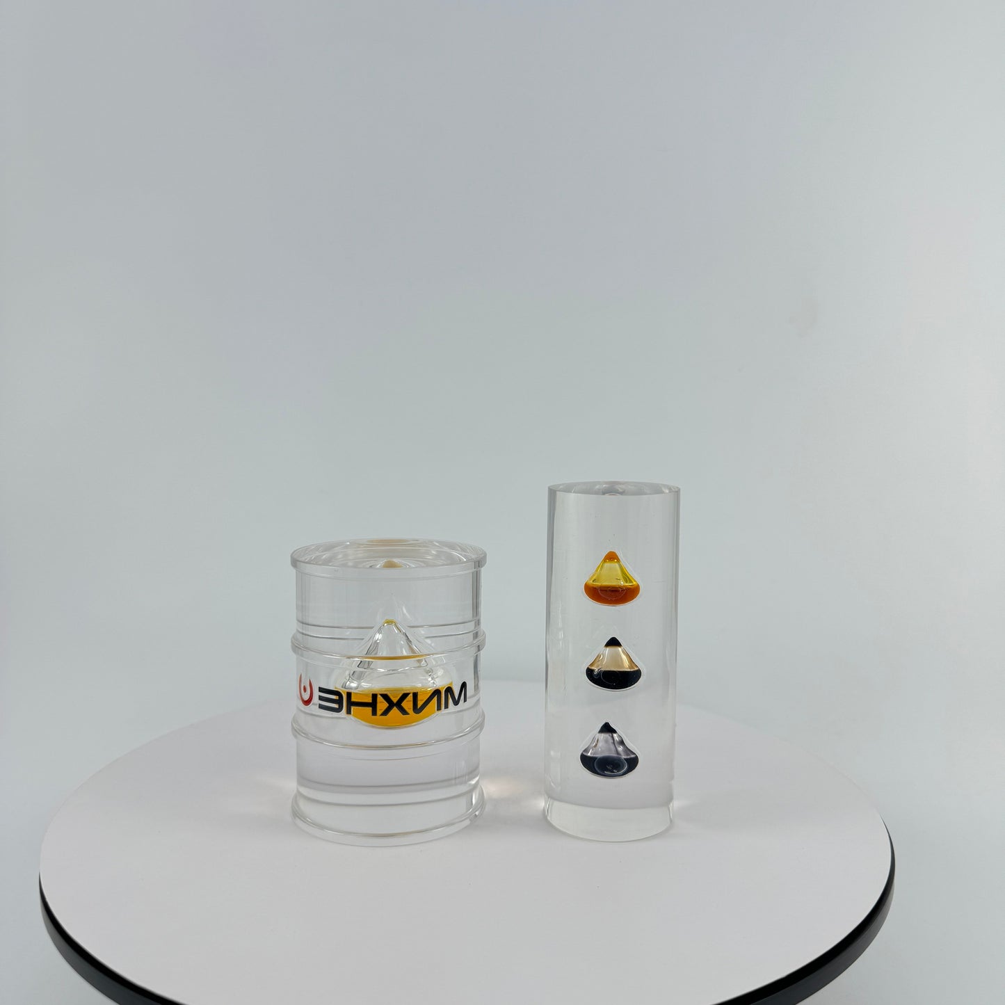 TRANSPARENT PAPER WEIGHT ENCAPSULATED WITH TEAR DROP OIL BOTTLE