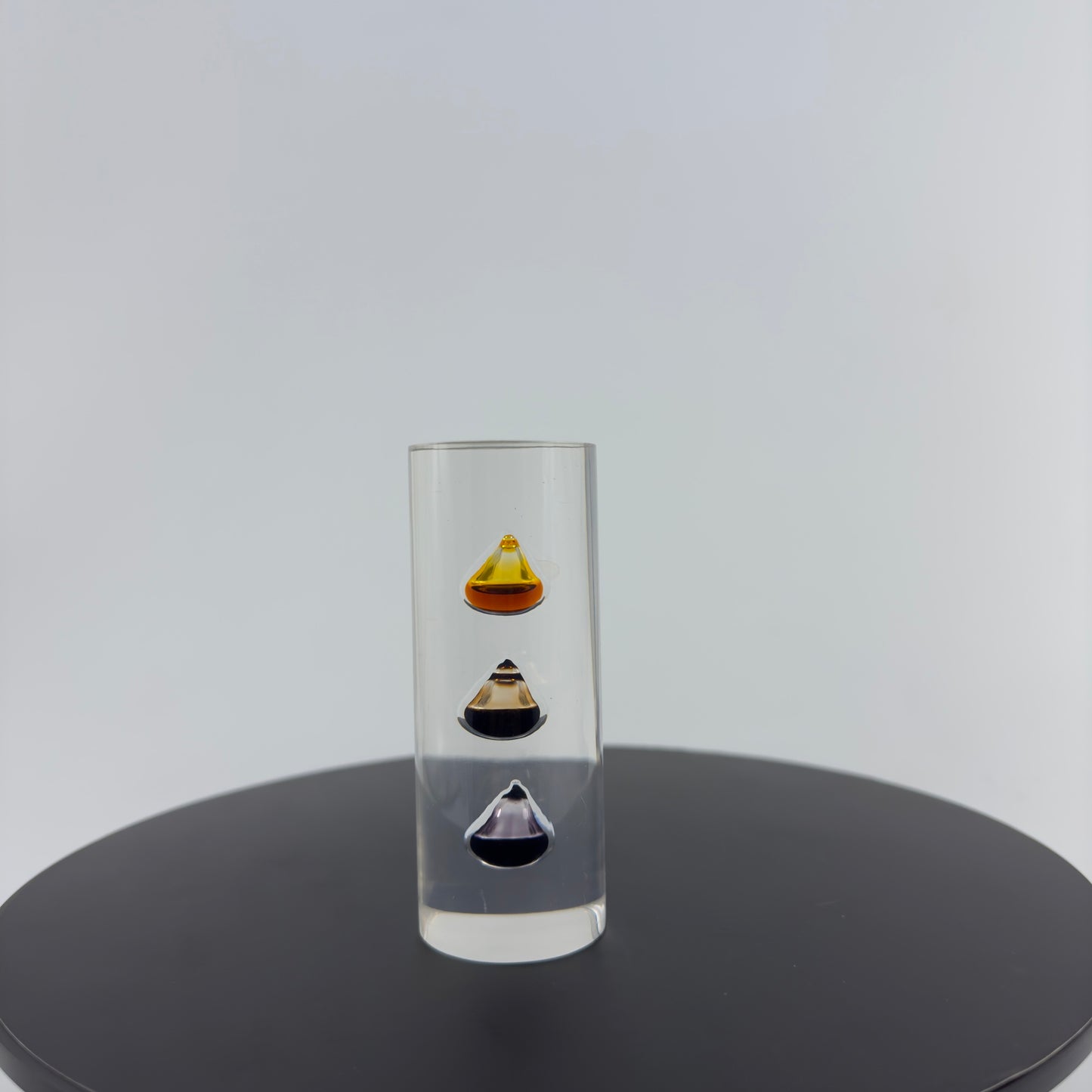 TRANSPARENT PAPER WEIGHT ENCAPSULATED WITH TEAR DROP OIL BOTTLE