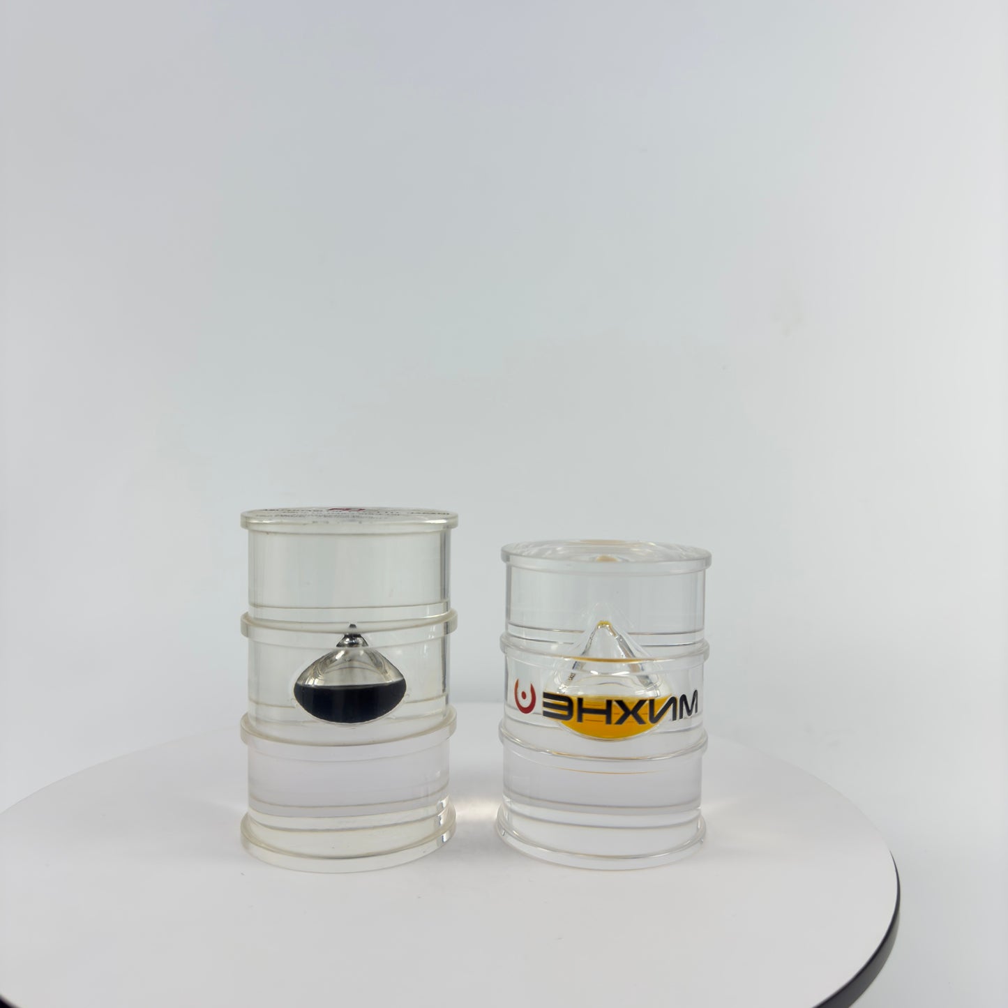 TRANSPARENT PAPER WEIGHT ENCAPSULATED WITH TEAR DROP OIL BOTTLE
