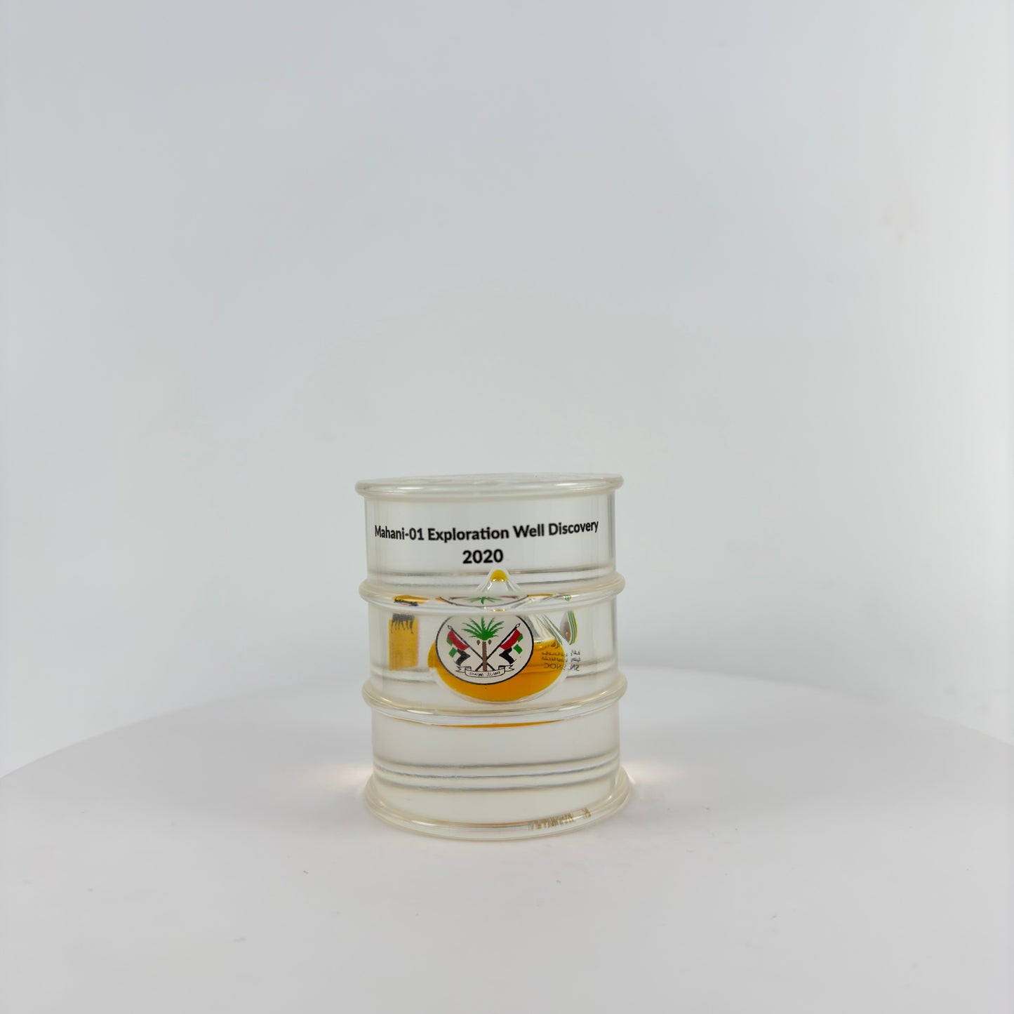 TRANSPARENT PAPER WEIGHT ENCAPSULATED WITH TEAR DROP OIL BOTTLE