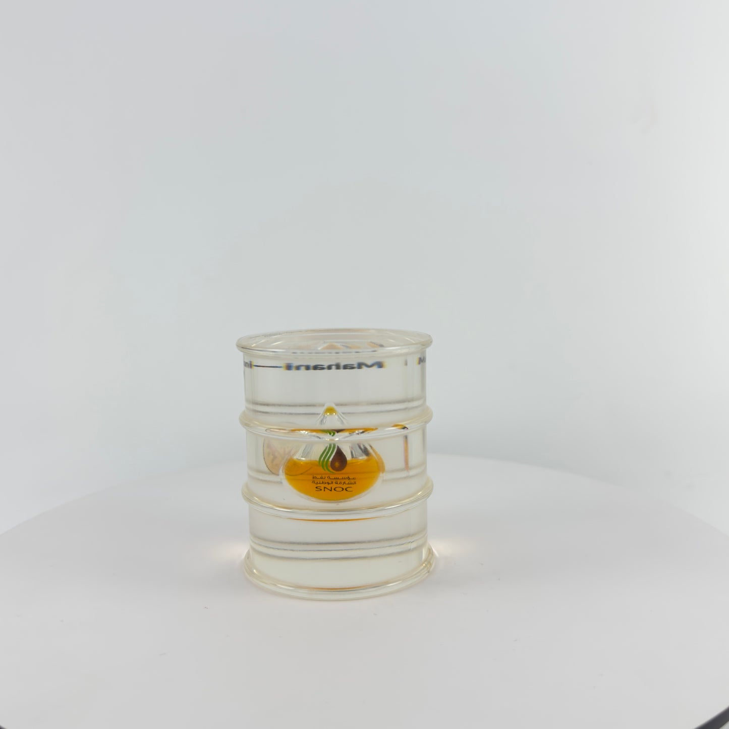 TRANSPARENT PAPER WEIGHT ENCAPSULATED WITH TEAR DROP OIL BOTTLE