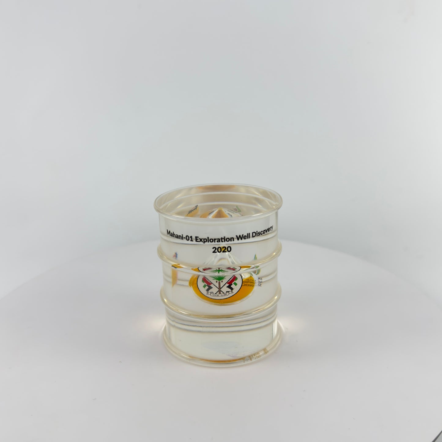 TRANSPARENT PAPER WEIGHT ENCAPSULATED WITH TEAR DROP OIL BOTTLE
