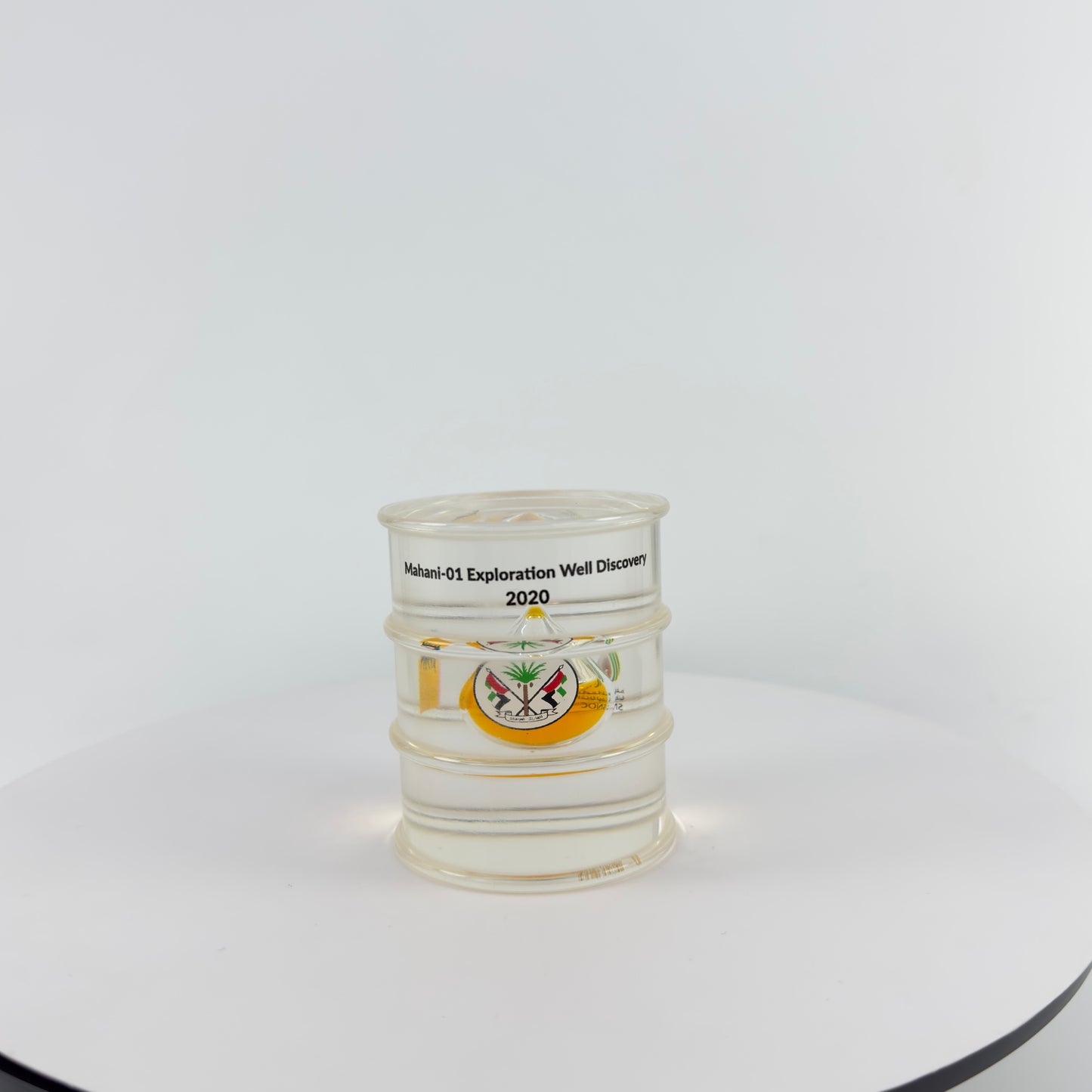 TRANSPARENT PAPER WEIGHT ENCAPSULATED WITH TEAR DROP OIL BOTTLE