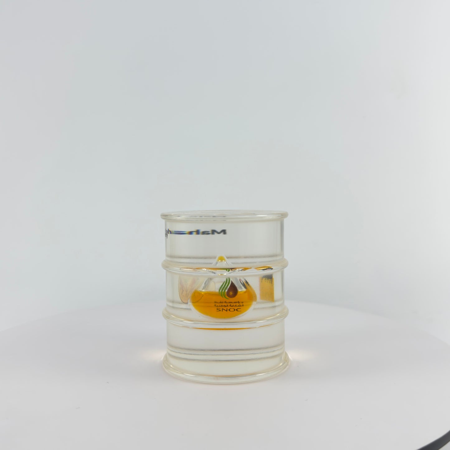 TRANSPARENT PAPER WEIGHT ENCAPSULATED WITH TEAR DROP OIL BOTTLE
