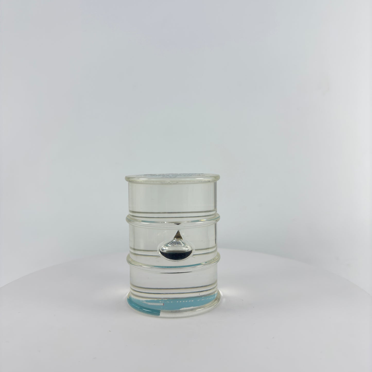 TRANSPARENT PAPER WEIGHT ENCAPSULATED WITH TEAR DROP OIL BOTTLE