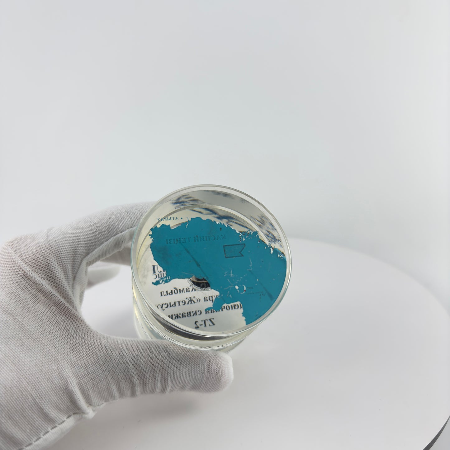 TRANSPARENT PAPER WEIGHT ENCAPSULATED WITH TEAR DROP OIL BOTTLE