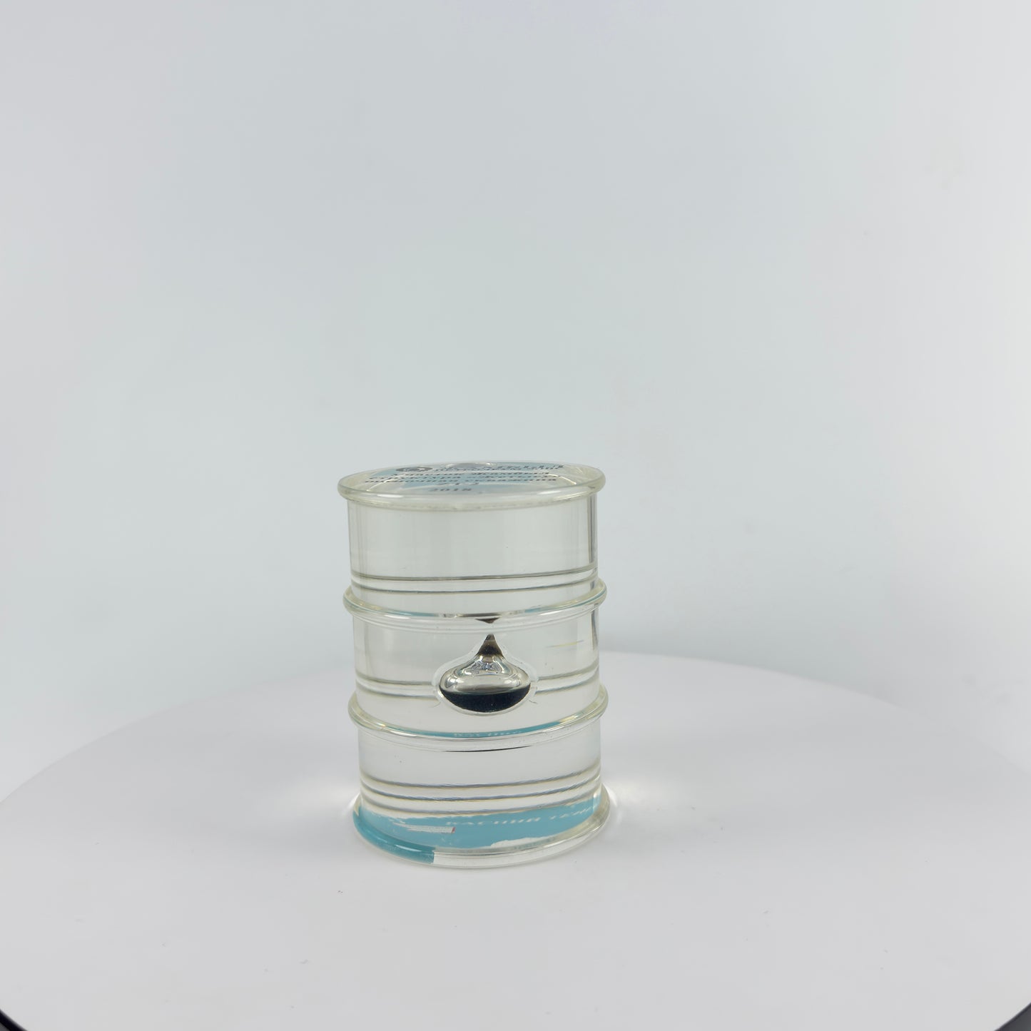 TRANSPARENT PAPER WEIGHT ENCAPSULATED WITH TEAR DROP OIL BOTTLE