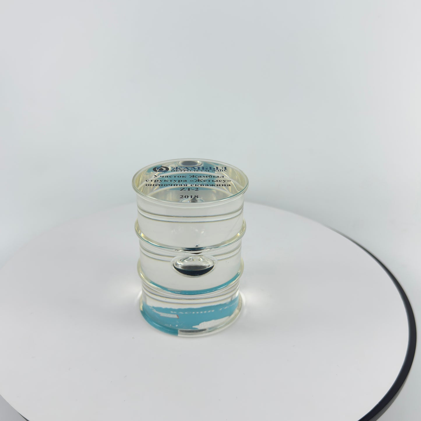 TRANSPARENT PAPER WEIGHT ENCAPSULATED WITH TEAR DROP OIL BOTTLE