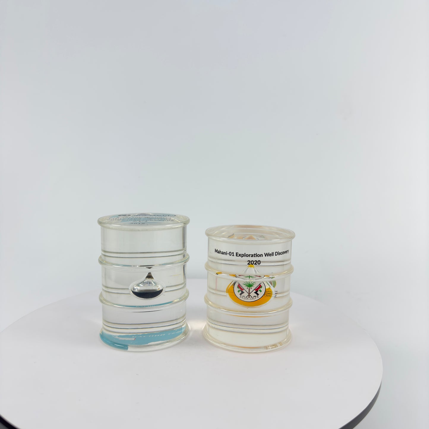 TRANSPARENT PAPER WEIGHT ENCAPSULATED WITH TEAR DROP OIL BOTTLE