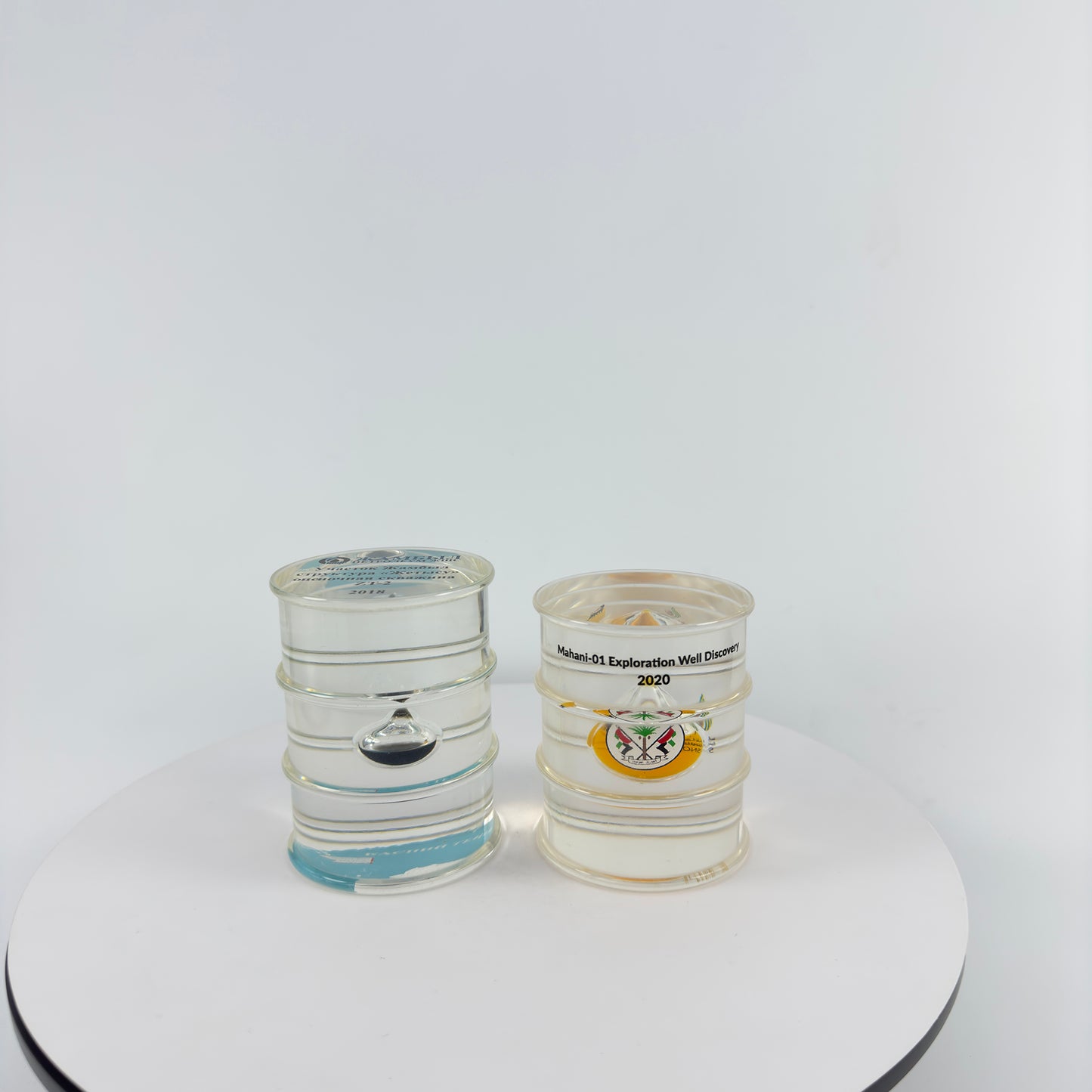 TRANSPARENT PAPER WEIGHT ENCAPSULATED WITH TEAR DROP OIL BOTTLE