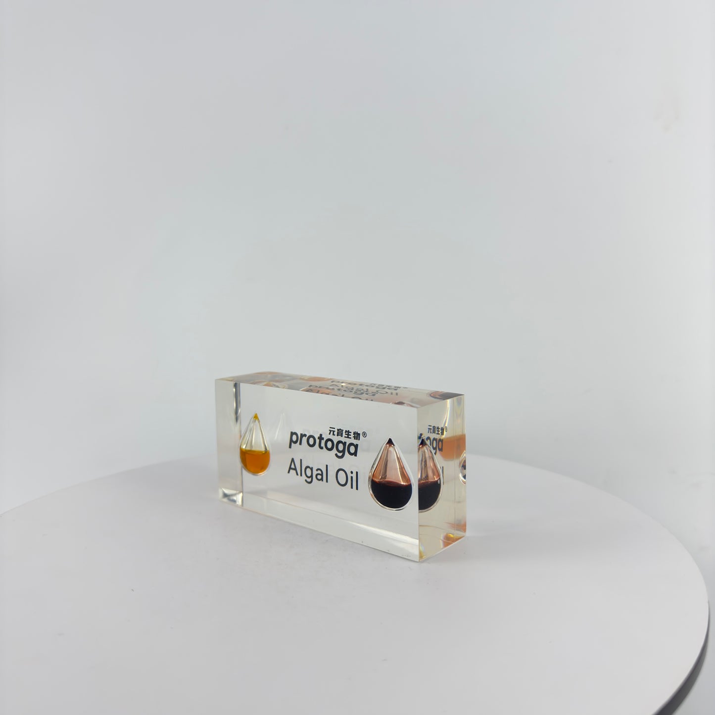 TRANSPARENT PAPER WEIGHT ENCAPSULATED WITH TEAR DROP OIL BOTTLE