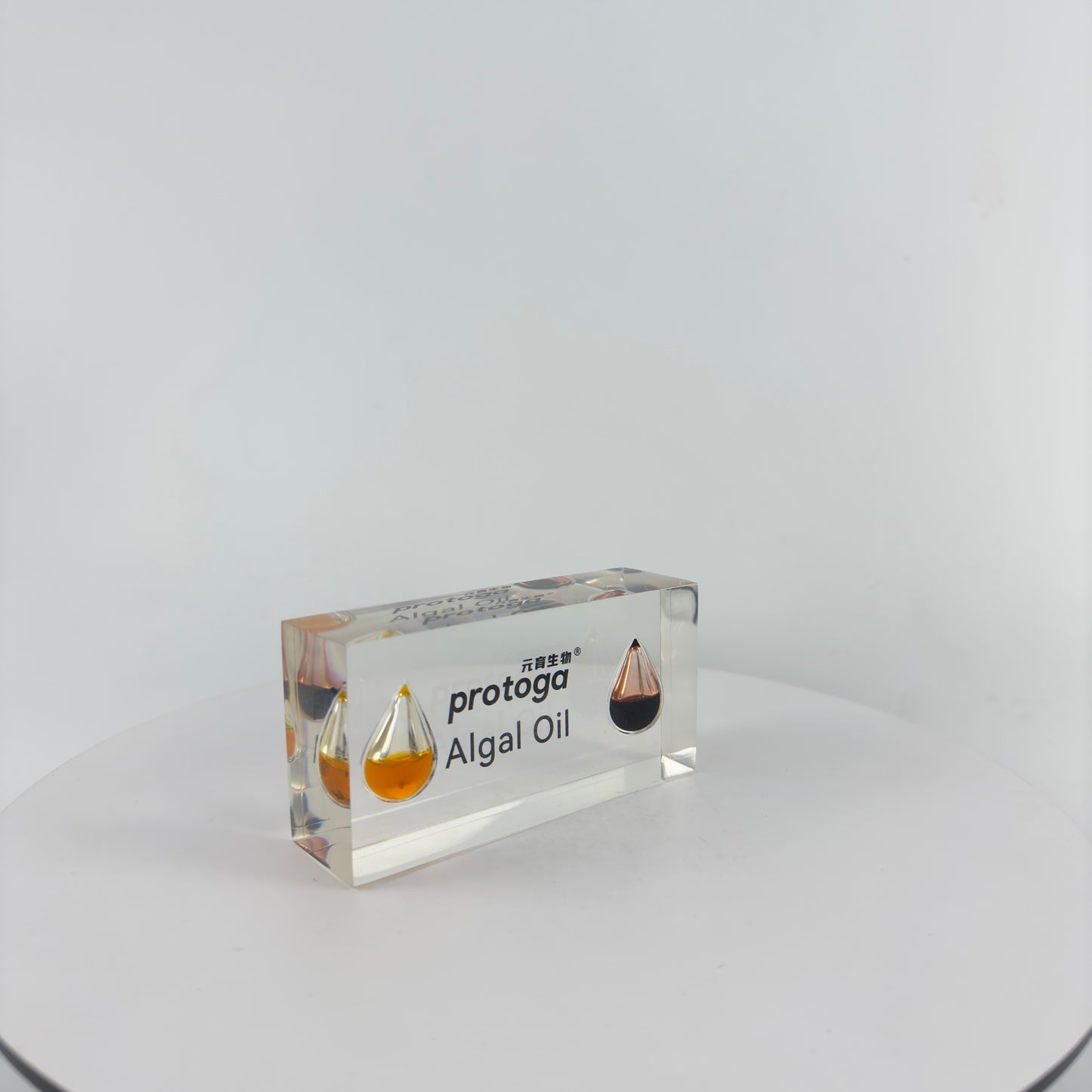 TRANSPARENT PAPER WEIGHT ENCAPSULATED WITH TEAR DROP OIL BOTTLE