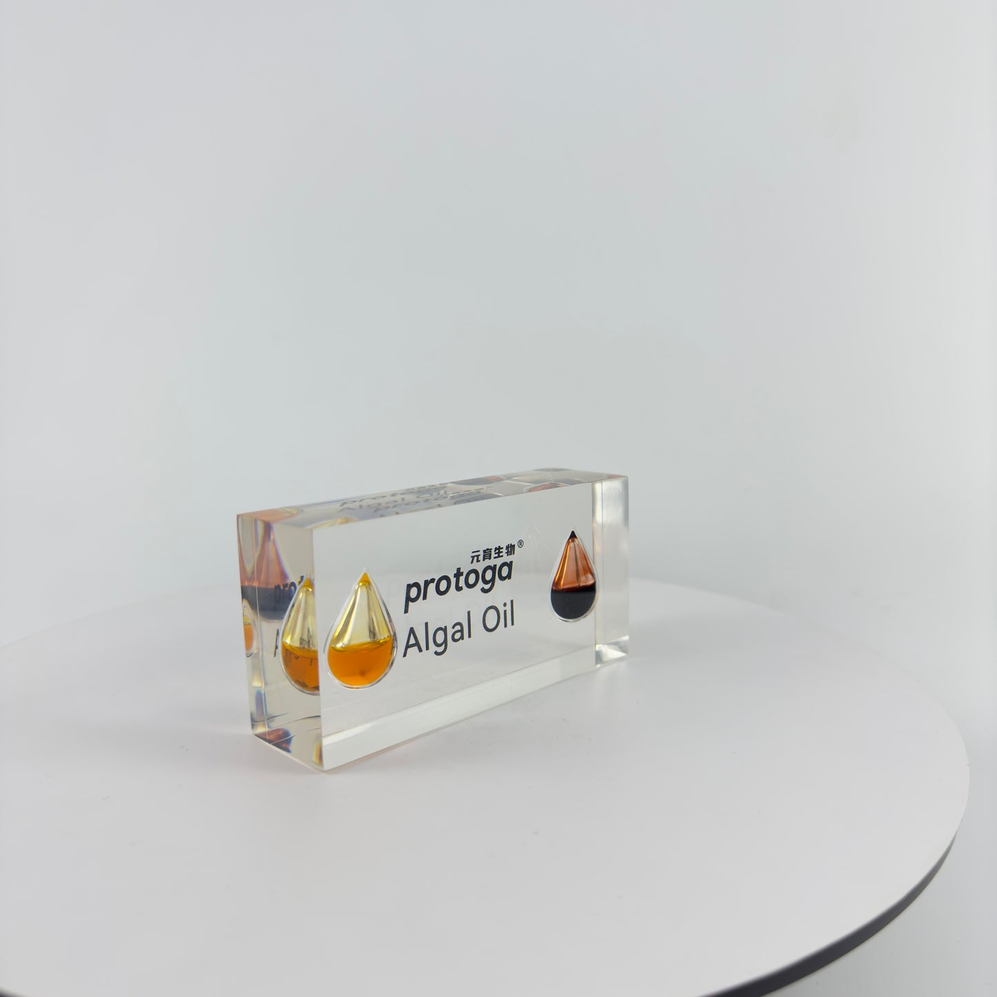 TRANSPARENT PAPER WEIGHT ENCAPSULATED WITH TEAR DROP OIL BOTTLE