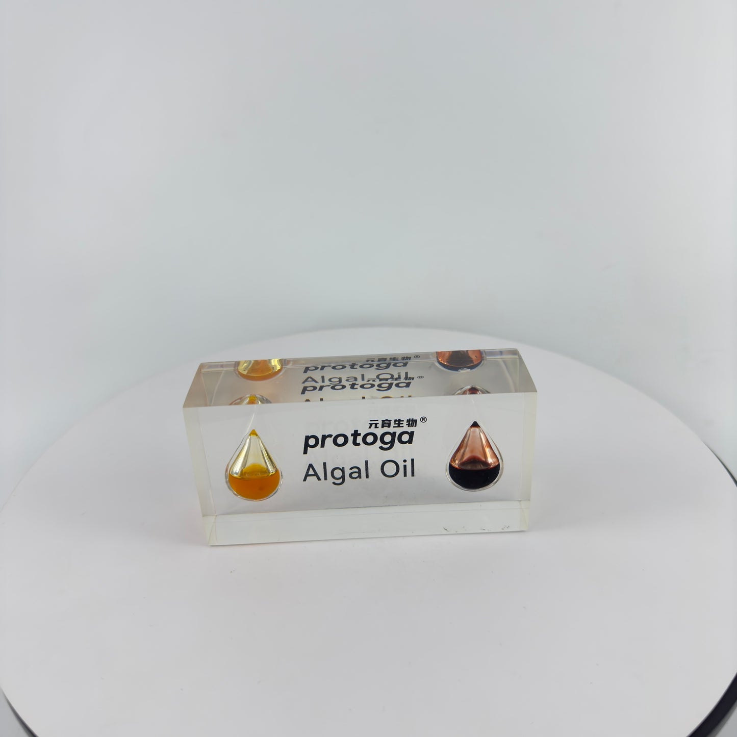 TRANSPARENT PAPER WEIGHT ENCAPSULATED WITH TEAR DROP OIL BOTTLE