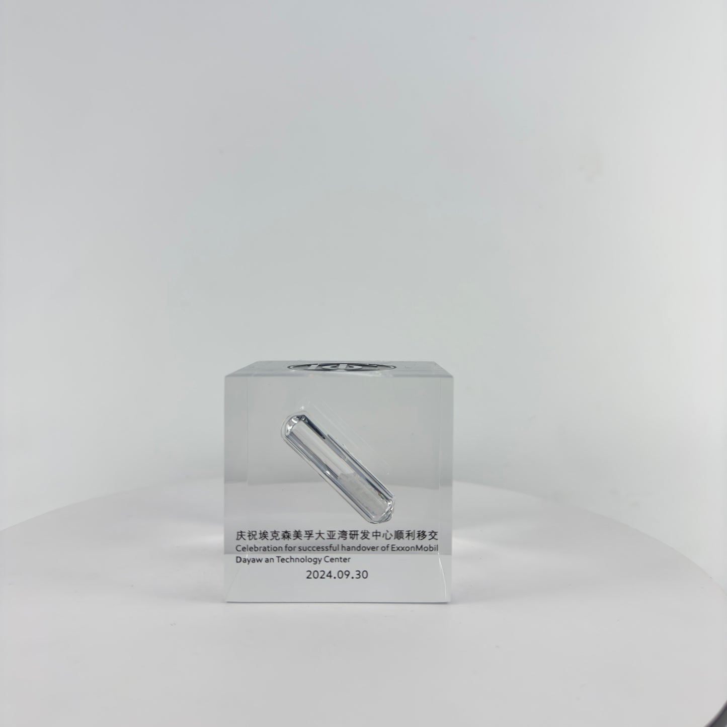 TRANSPARENT PAPER WEIGHT ENCAPSULATED WITH GLASS TUBE