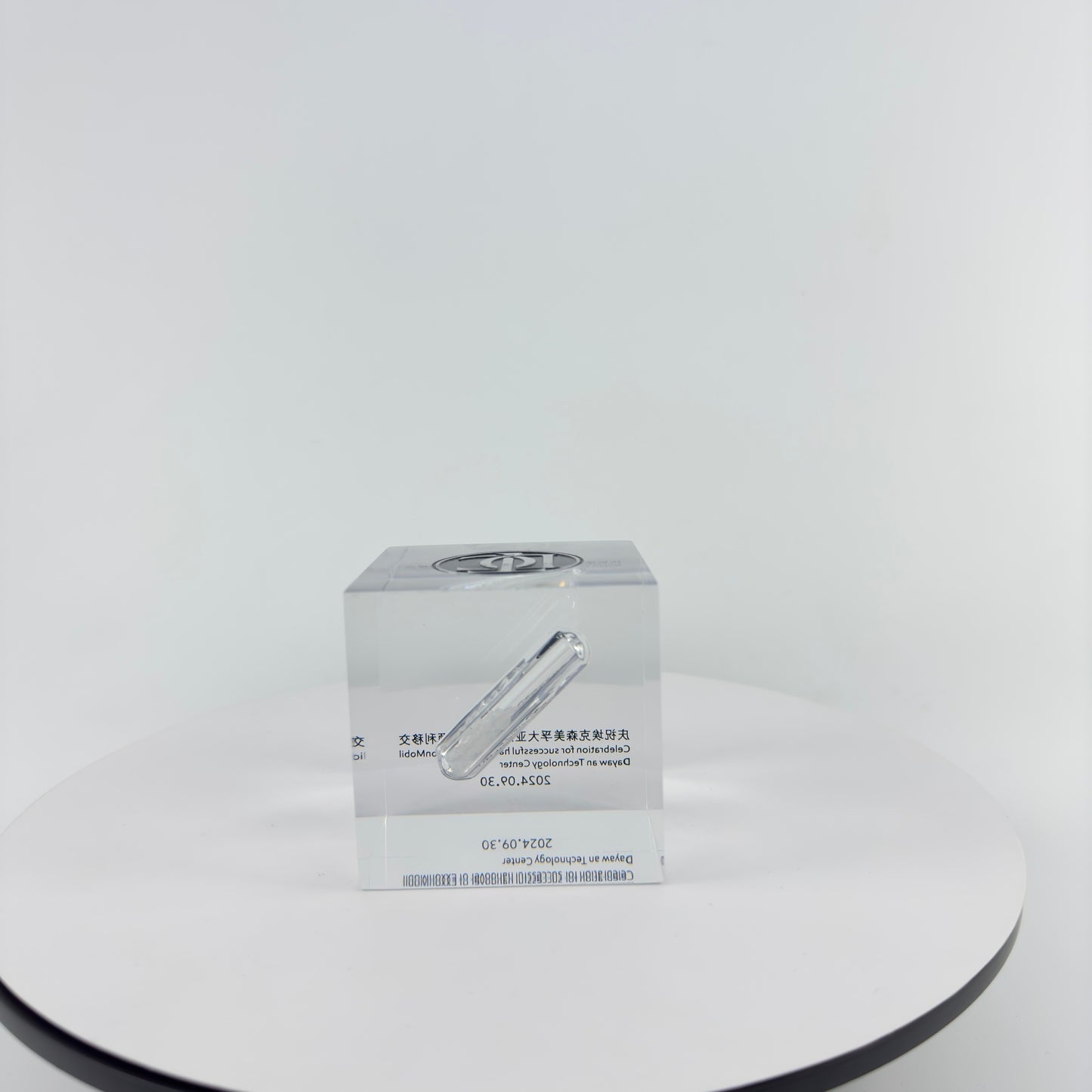 TRANSPARENT PAPER WEIGHT ENCAPSULATED WITH GLASS TUBE