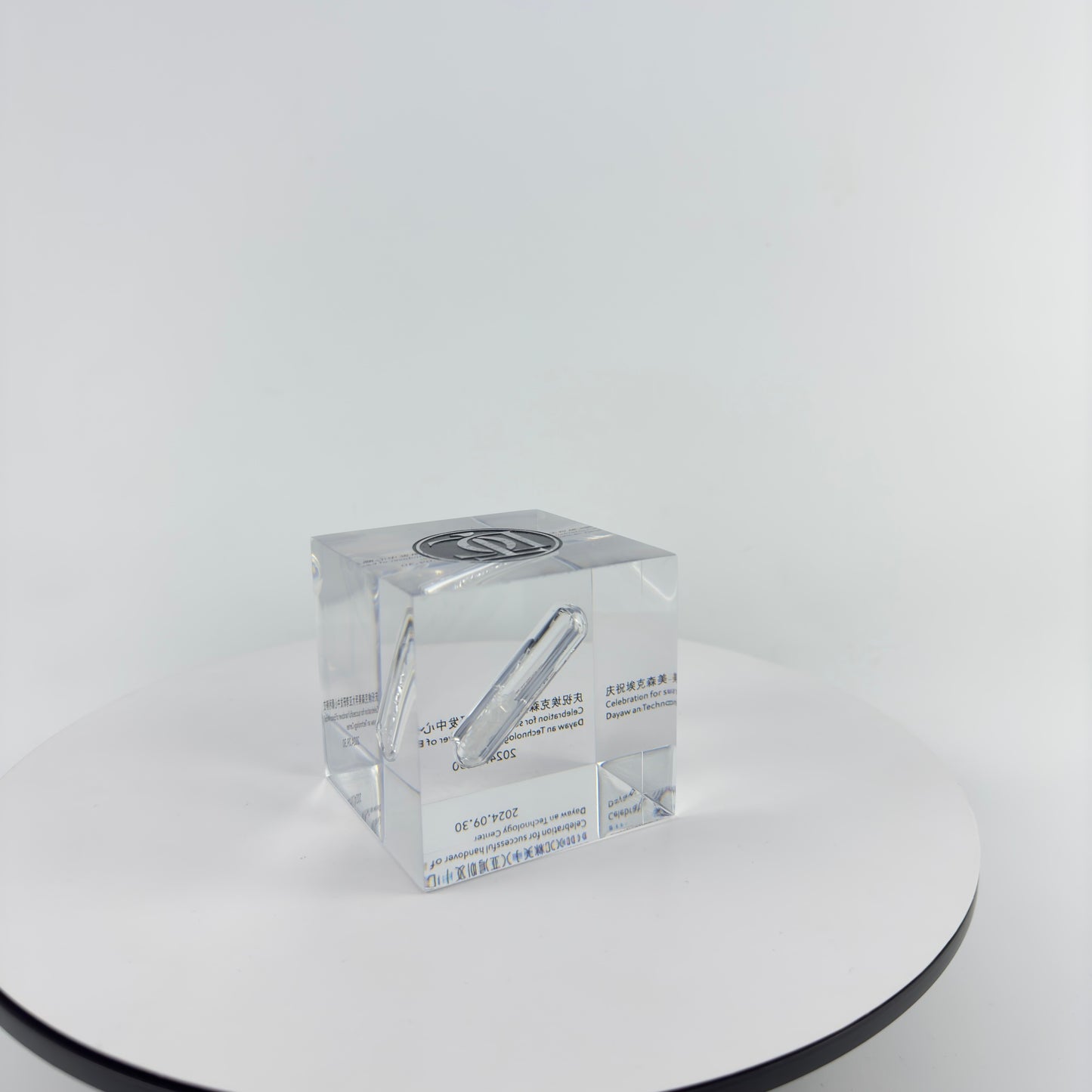 TRANSPARENT PAPER WEIGHT ENCAPSULATED WITH GLASS TUBE