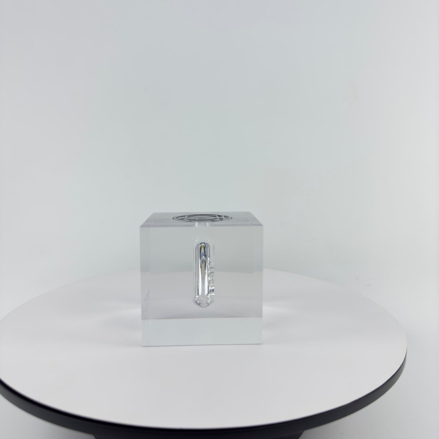 TRANSPARENT PAPER WEIGHT ENCAPSULATED WITH GLASS TUBE