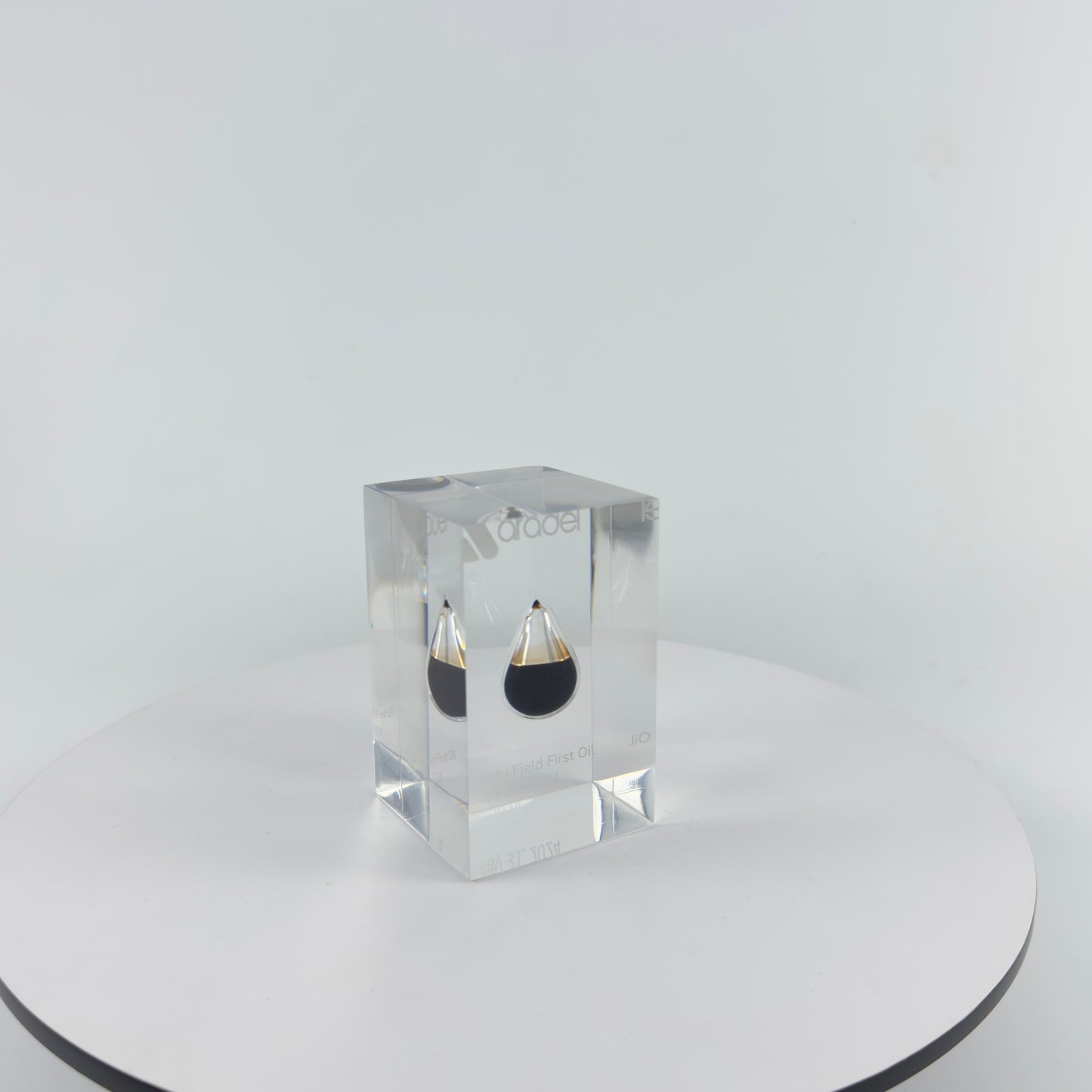 TRANSPARENT PAPER WEIGHT ENCAPSULATED WITH TEAR DROP OIL BOTTLE