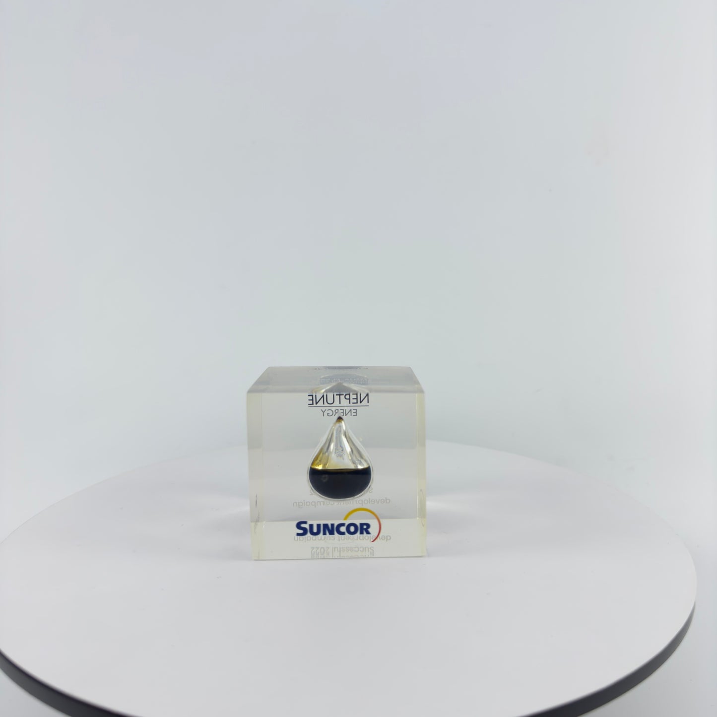 TRANSPARENT PAPER WEIGHT ENCAPSULATED WITH TEAR DROP OIL BOTTLE