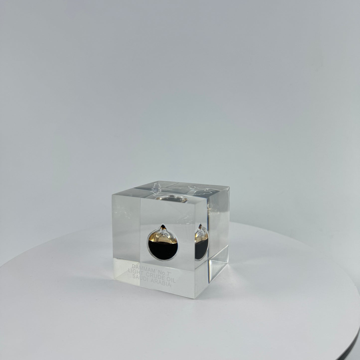 TRANSPARENT PAPER WEIGHT ENCAPSULATED WITH TEAR DROP OIL BOTTLE