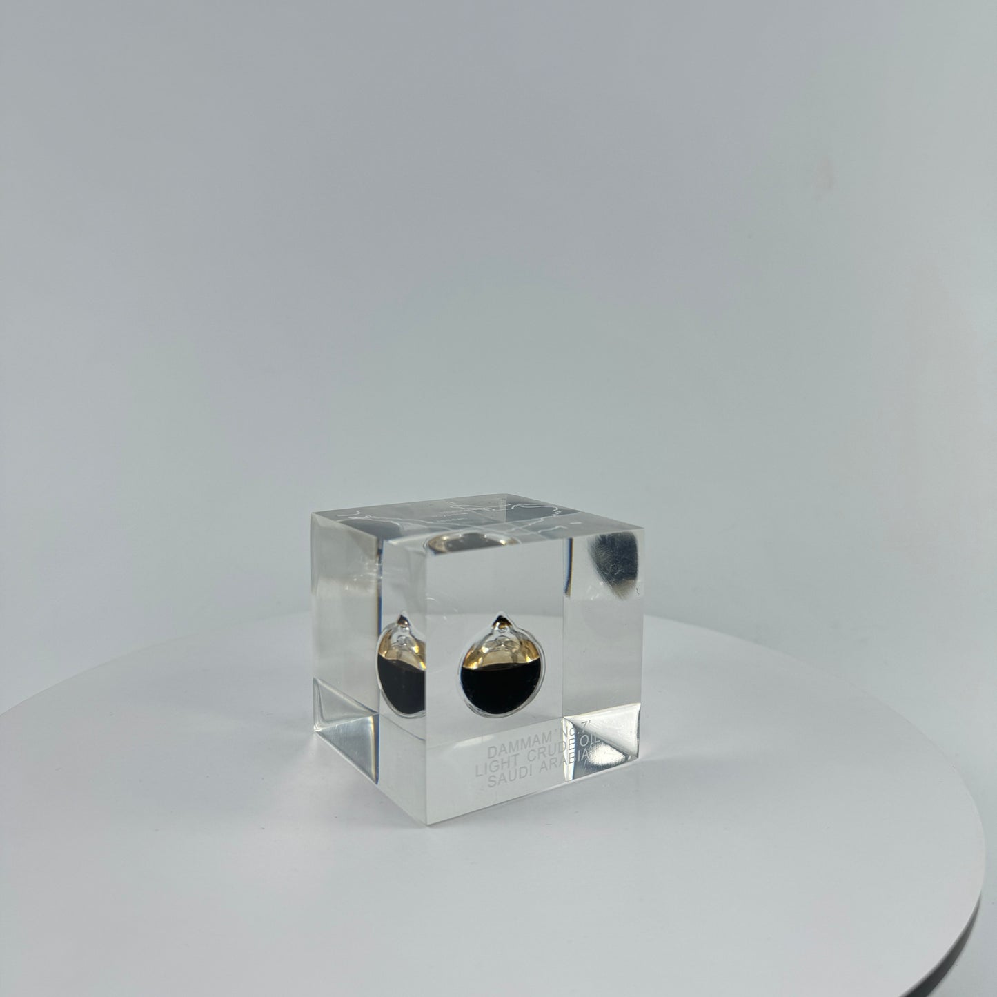 TRANSPARENT PAPER WEIGHT ENCAPSULATED WITH TEAR DROP OIL BOTTLE