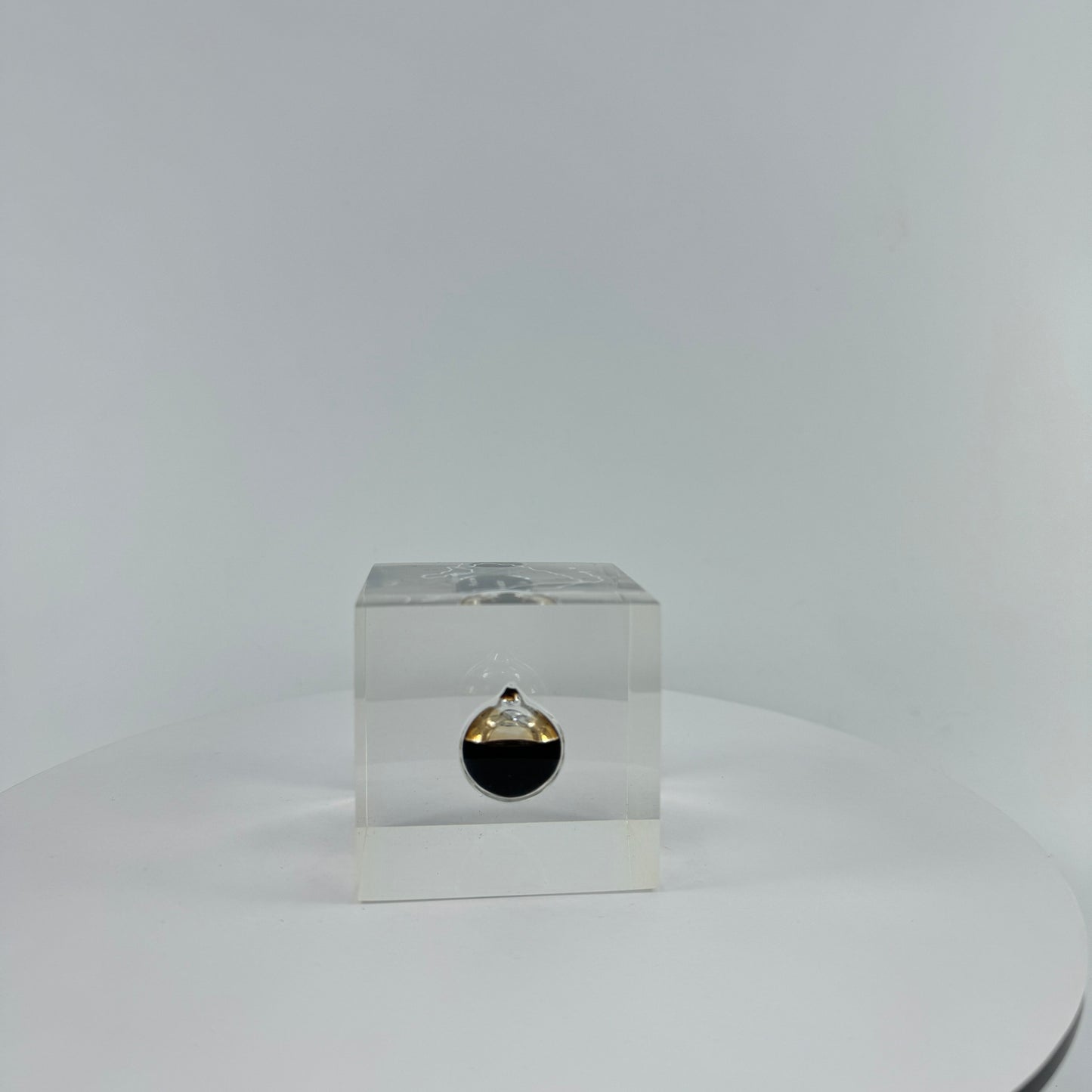 TRANSPARENT PAPER WEIGHT ENCAPSULATED WITH TEAR DROP OIL BOTTLE