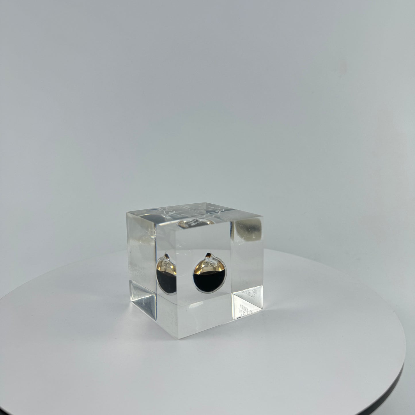 TRANSPARENT PAPER WEIGHT ENCAPSULATED WITH TEAR DROP OIL BOTTLE