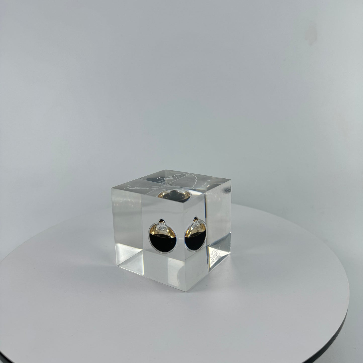 TRANSPARENT PAPER WEIGHT ENCAPSULATED WITH TEAR DROP OIL BOTTLE