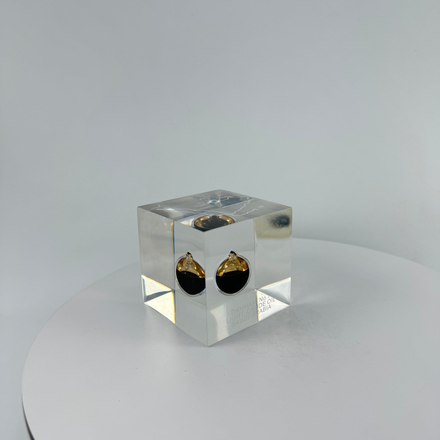 TRANSPARENT PAPER WEIGHT ENCAPSULATED WITH TEAR DROP OIL BOTTLE